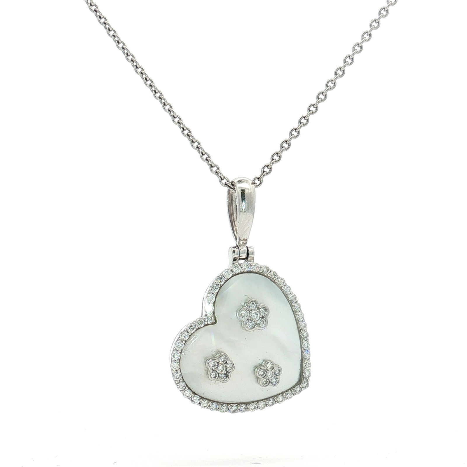 14K White Gold, Mother-of-Pearl, and 0.59ctw Diamond Heart Pendant Necklace: A contemporary necklace featuring a heart-shaped pendant suspended from a fine cable chain, both crafted in 14-karat white gold. The pendant is designed with a central white mother-of-pearl inlay ador