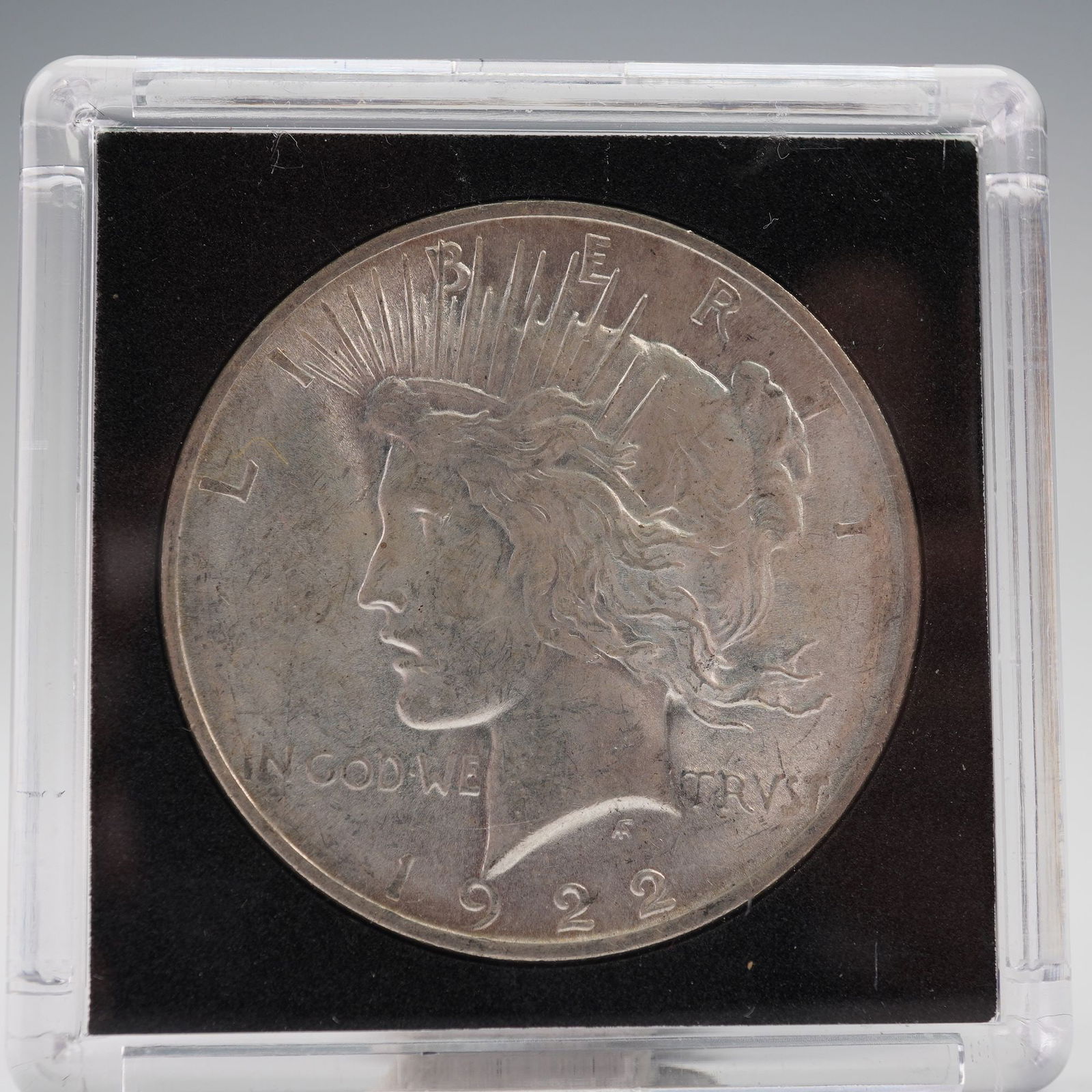 1922 Peace Silver Dollar: Features the profile of Lady Liberty on the obverse, crowned with rays of light, designed by Anthony de Francisci. The inscriptions read: LIBERTY, IN GOD WE TRVST, and the date 1922. The reverse