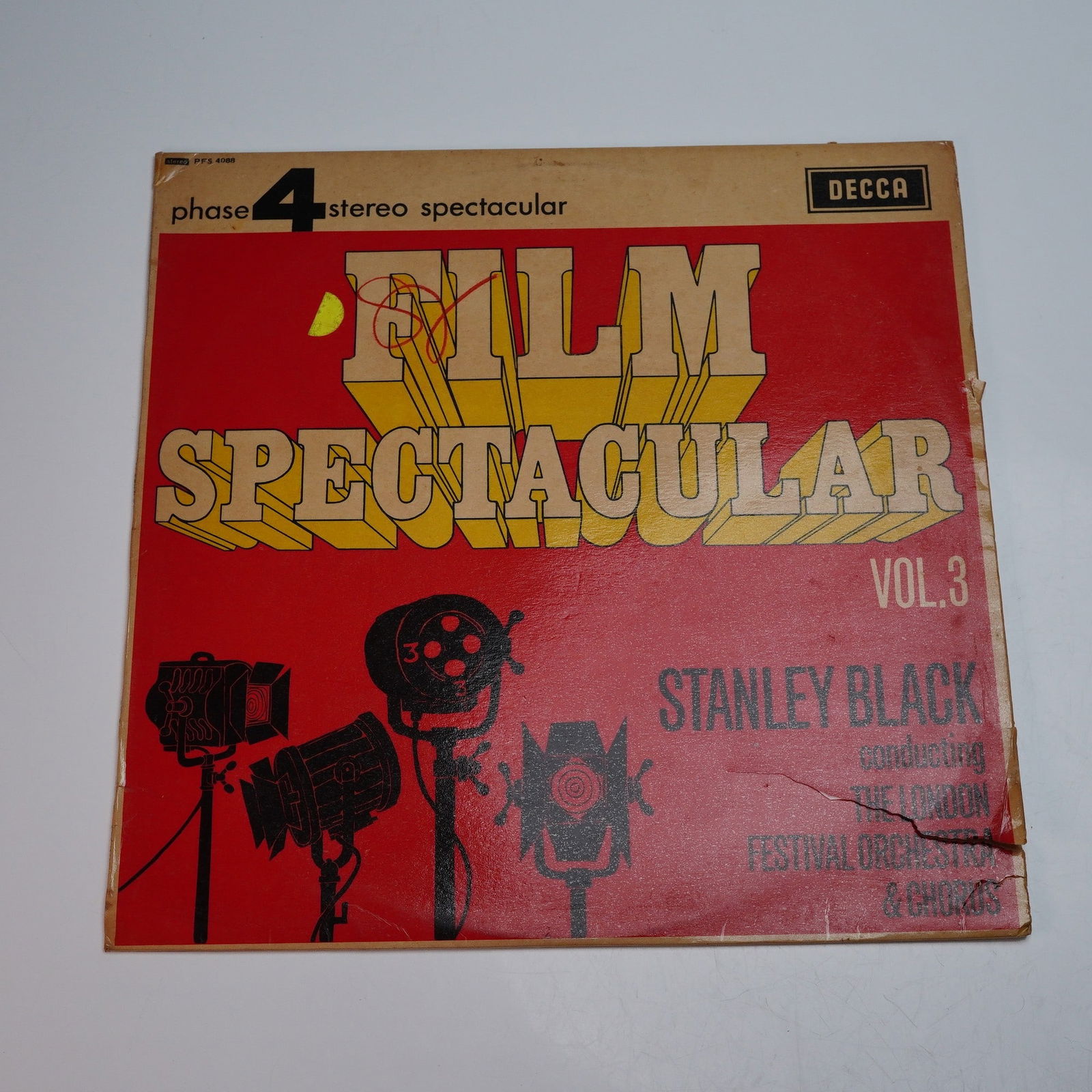 Decca Records Phase 4 Stereo Spectacular Vinyl Record, Film Spectacular!: This 12-inch stereo LP titled "Film Spectacular! Vol. 3" showcases cinematic selections performed by the London Festival Orchestra and Chorus under the direction of conductor Stanley Black. Released b