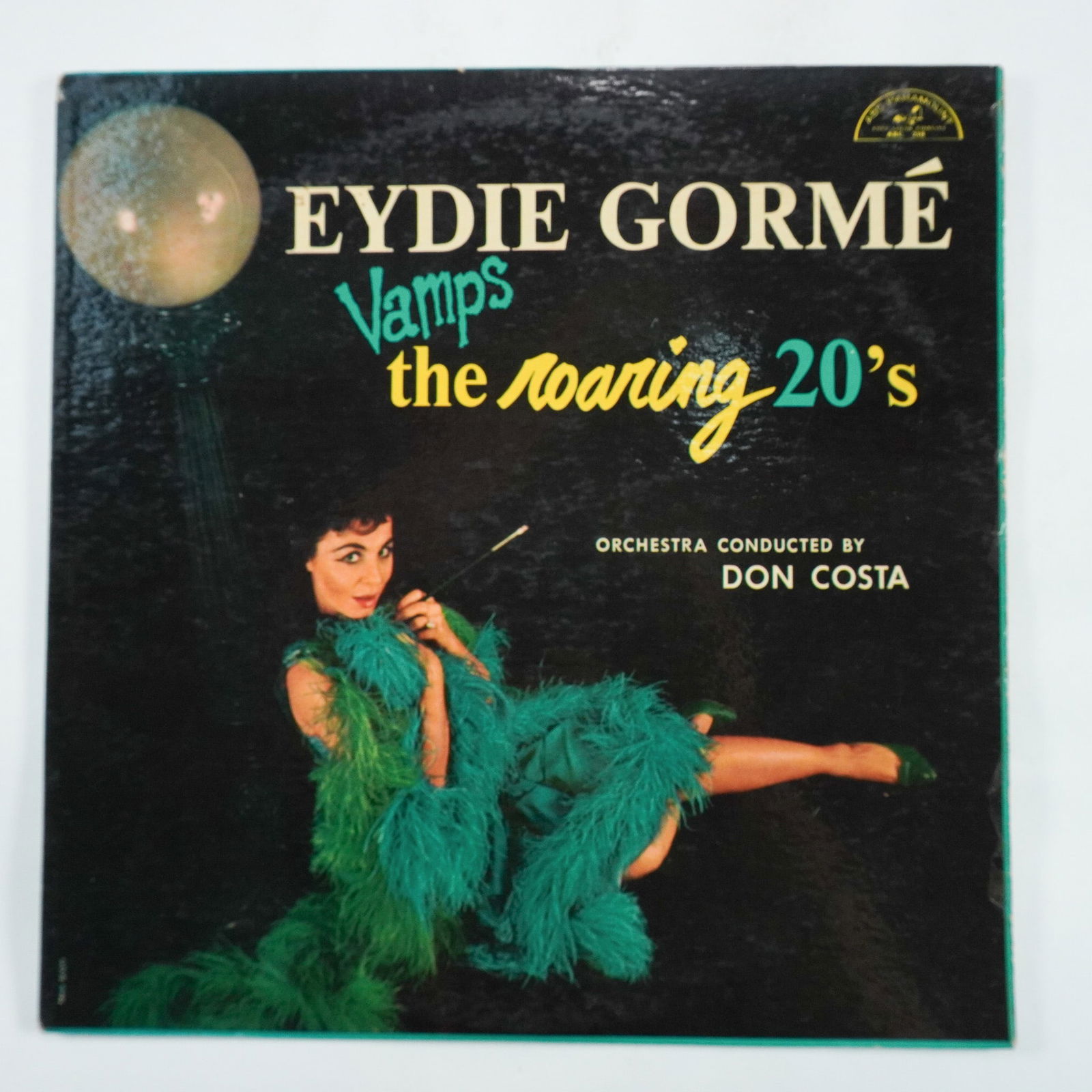 Eydie Gorme, Vamps the Roaring 20s Vinyl Record: Eydie Gorme's Vamps the Roaring 20s vinyl record, released by ABC-Paramount (ABC-218). This album features Gorme's lively interpretations of 1920s jazz standards, accompanied by an orchestra conducted