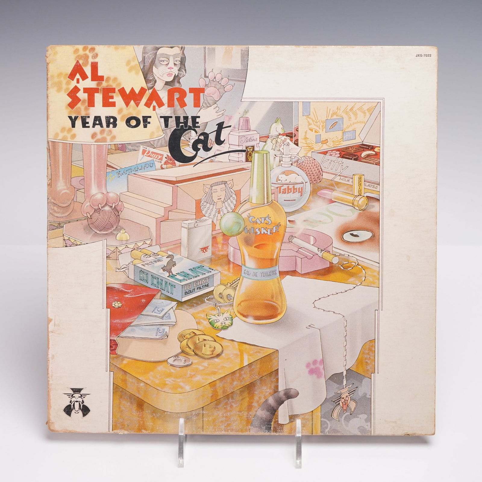 Janus Records Al Stewart Vinyl Record, Year of the Cat: 12-inch vinyl record album titled "Year of the Cat" by Al Stewart, released by Janus Records under catalog number JXS-7022. The record features a pop rock style within the rock genre. The front cover