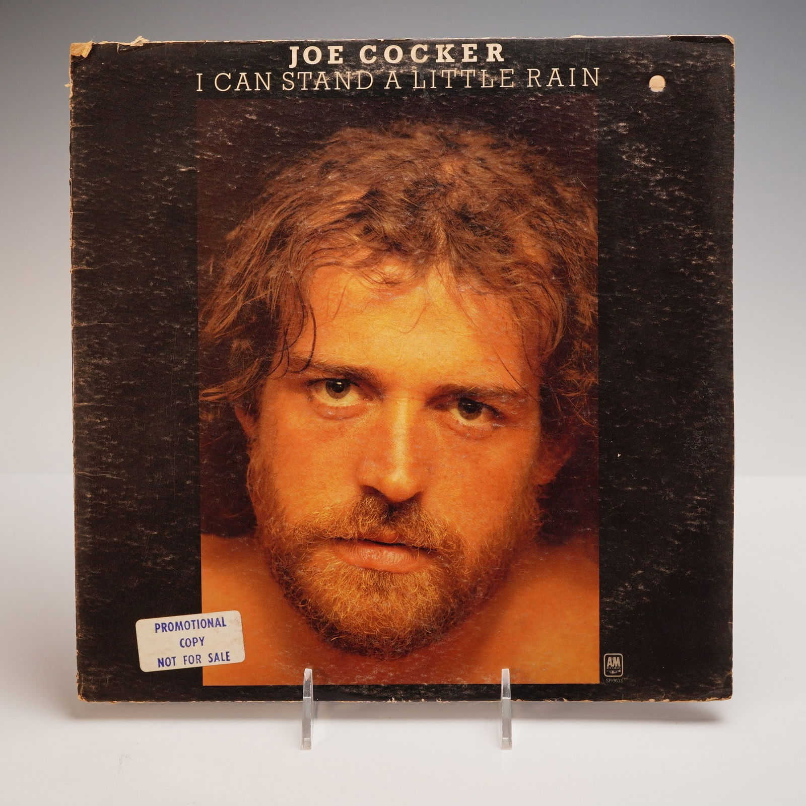 Joe Cocker, I Can Stand a Little Rain Vinyl LP: 1974 promotional copy of I Can Stand a Little Rain, released by A&M Records. Includes signature ballads like You Are So Beautiful, Put Out the Light, and Don't Forget Me. A soulful, emotional high poi