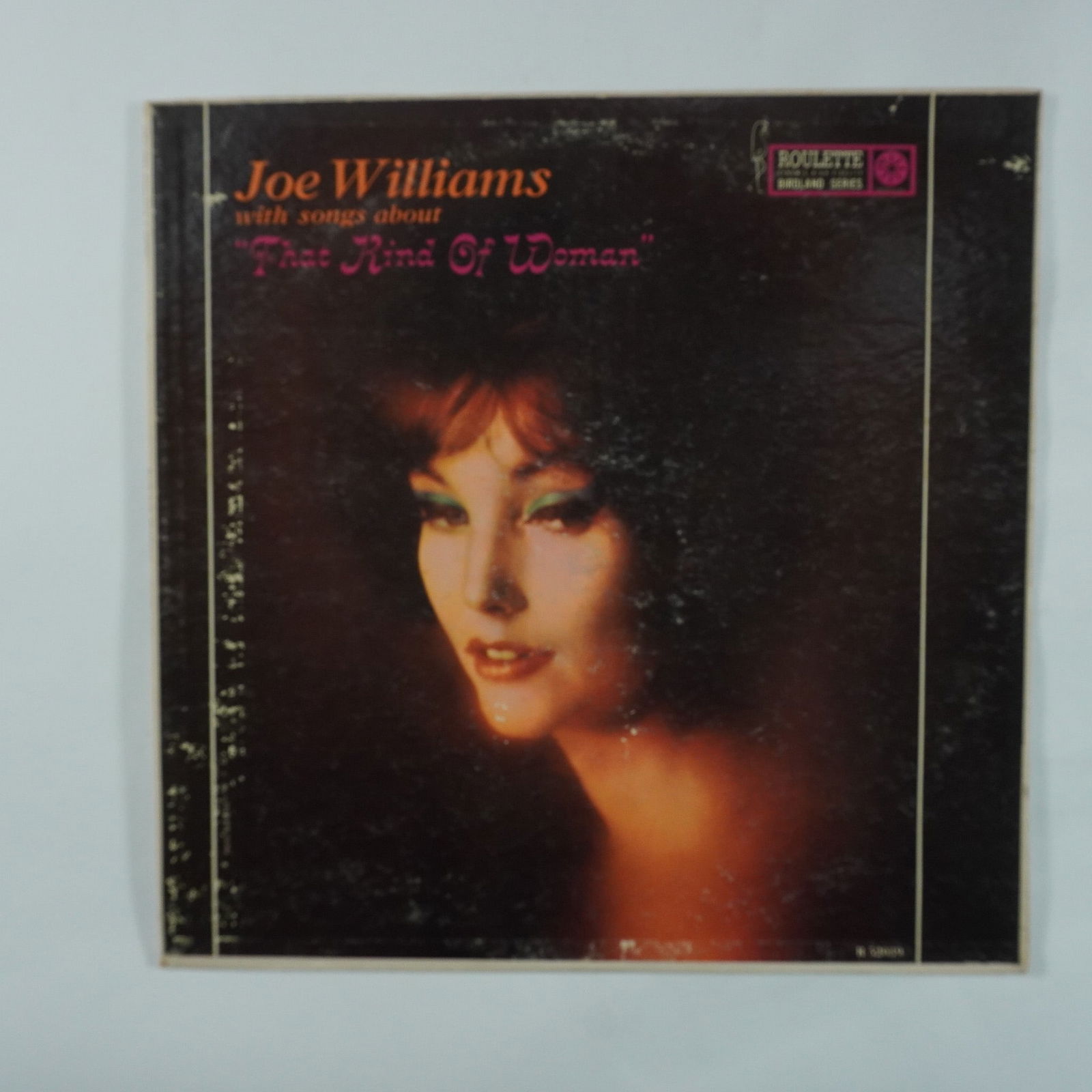 Joe Williams, That Kind of Woman Vinyl Record: Roulette Records vinyl record That Kind of Woman by Joe Williams, released in 1959. This jazz and blues album features Williams' smooth baritone vocals with orchestral accompaniment conducted by Jimmy