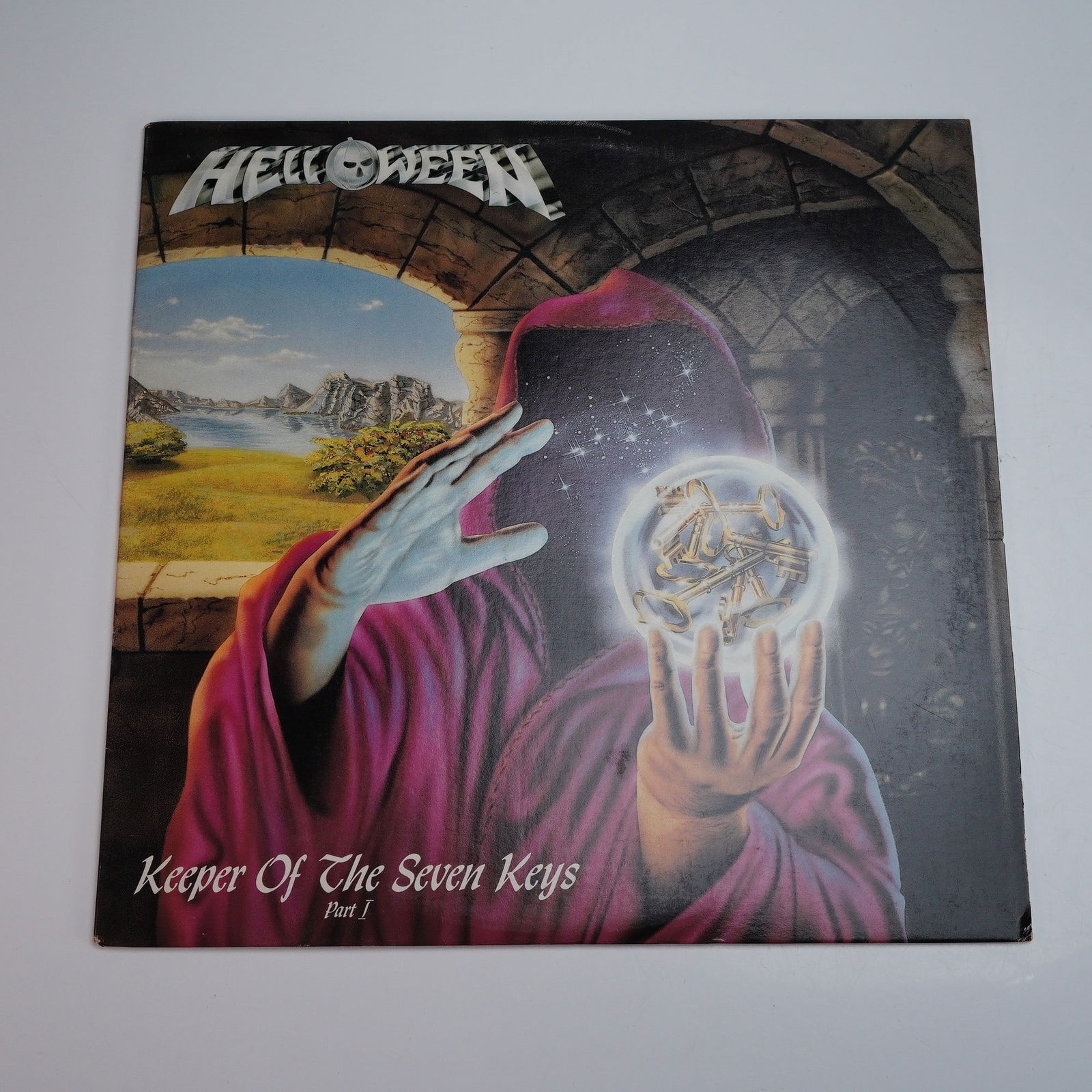 RCA Victor Records Helloween Vinyl Record, Keeper of the Seven Keys Part I: This vinyl LP release of "Keeper of the Seven Keys - Part I" by German power metal pioneers Helloween is presented under the RCA Victor label. The record features a visually striking cover illustratio