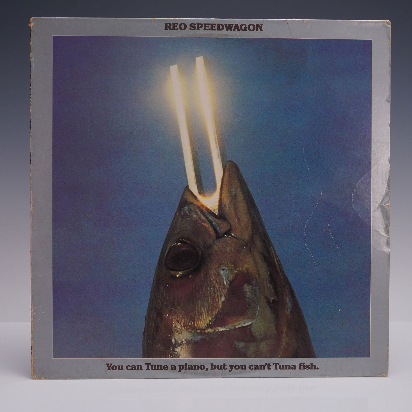 REO Speedwagon 'You Can Tune a Piano, But You Can't Tuna Fish' Vinyl LP: 1978 Epic Records release of You Can Tune a Piano, But You Can't Tuna Fish by REO Speedwagon. Includes the classic anthem 'Roll with the Changes' along with 'Time for Me to Fly' and other fan favorite