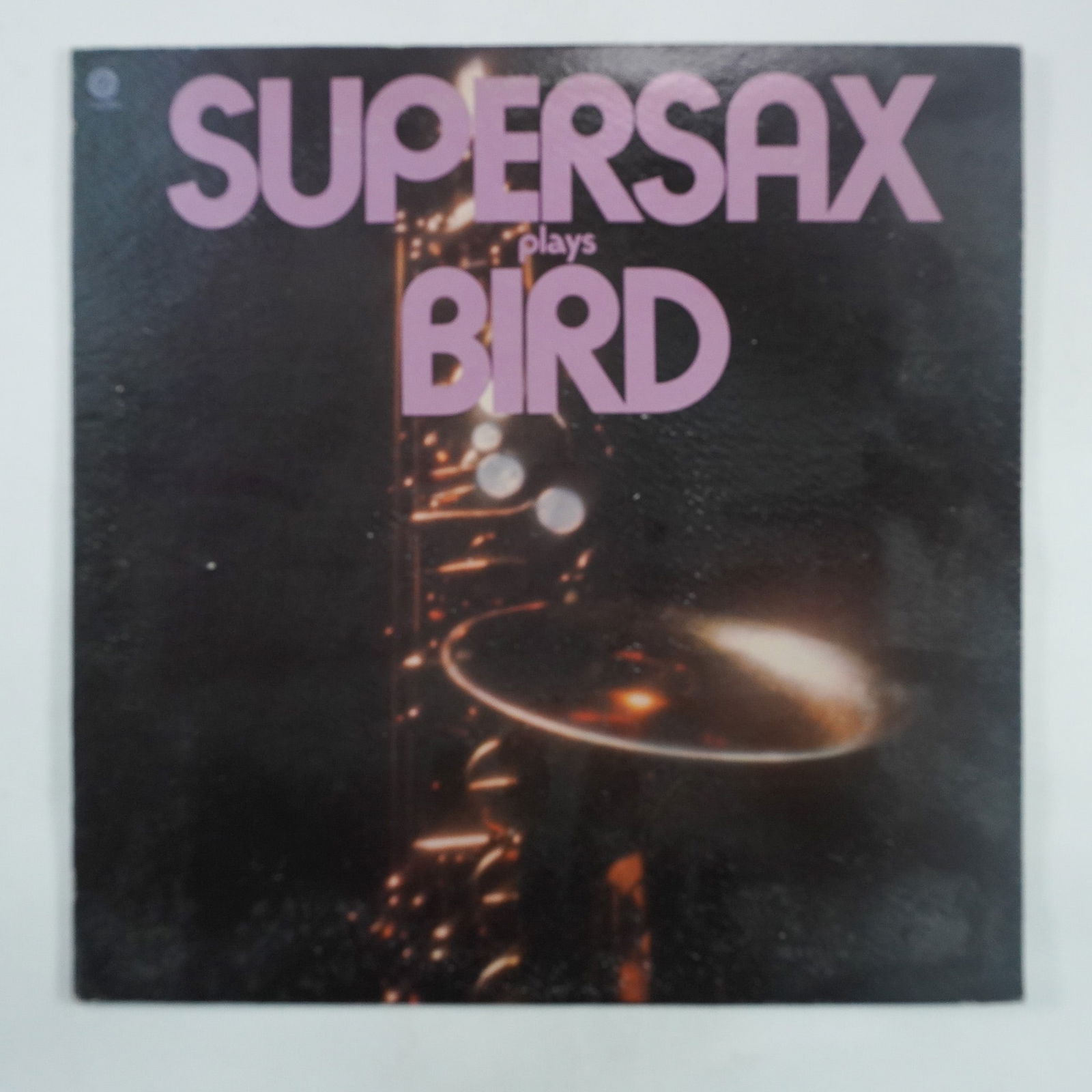Supersax Plays Bird Vinyl Record Album: Released in 1973 by Capitol Records, Supersax Plays Bird is a tribute album by the jazz ensemble Supersax, dedicated to the legendary saxophonist Charlie "Bird" Parker. The album features harmonized a