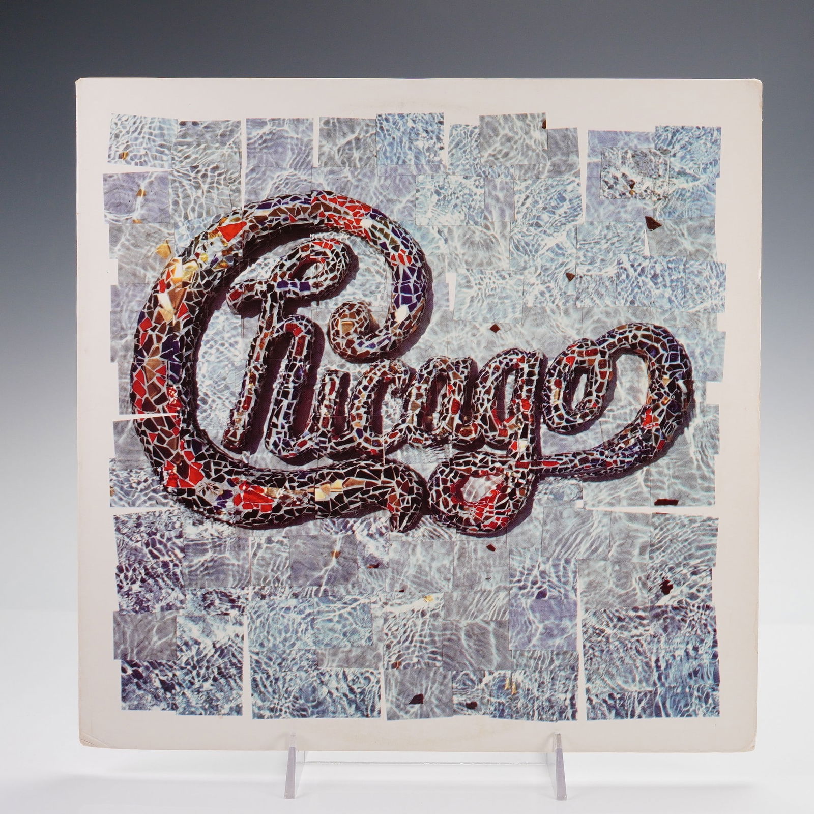 Warner Bros. Records Chicago Vinyl Record, Chicago 18: This 12-inch vinyl record is the 1986 studio album "Chicago 18" by the American rock band Chicago, issued by Warner Bros. Records. Produced by David Foster and engineered by Humberto Gatica, this rele