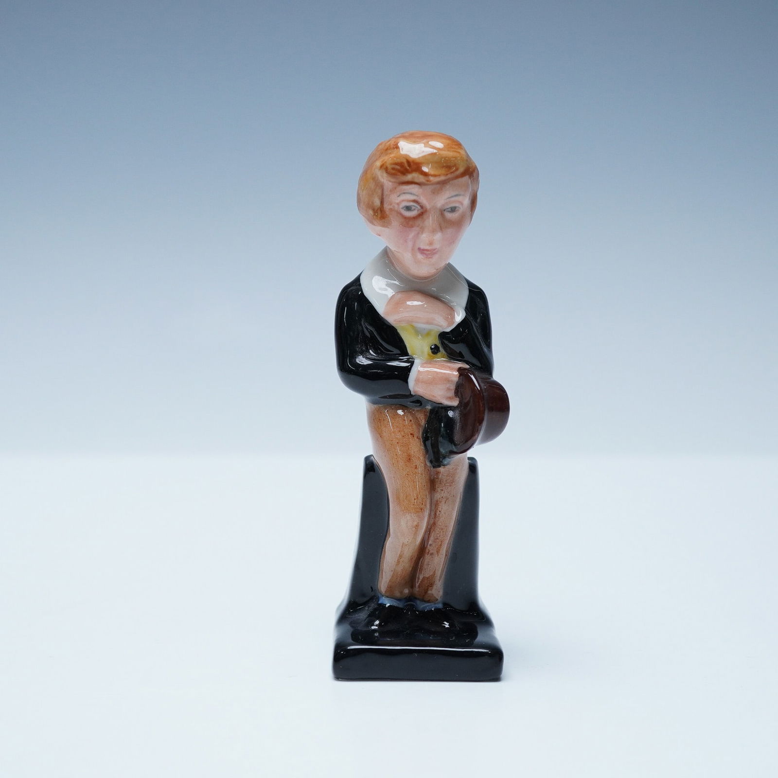 David Copperfield M88 - Royal Doulton Figurine: Royal Doulton David Copperfield figurine, model M88, from the Dickens Miniatures series. Inspired by Charles Dickens' classic novel, this hand-painted figurine captures the young David Copperfield in