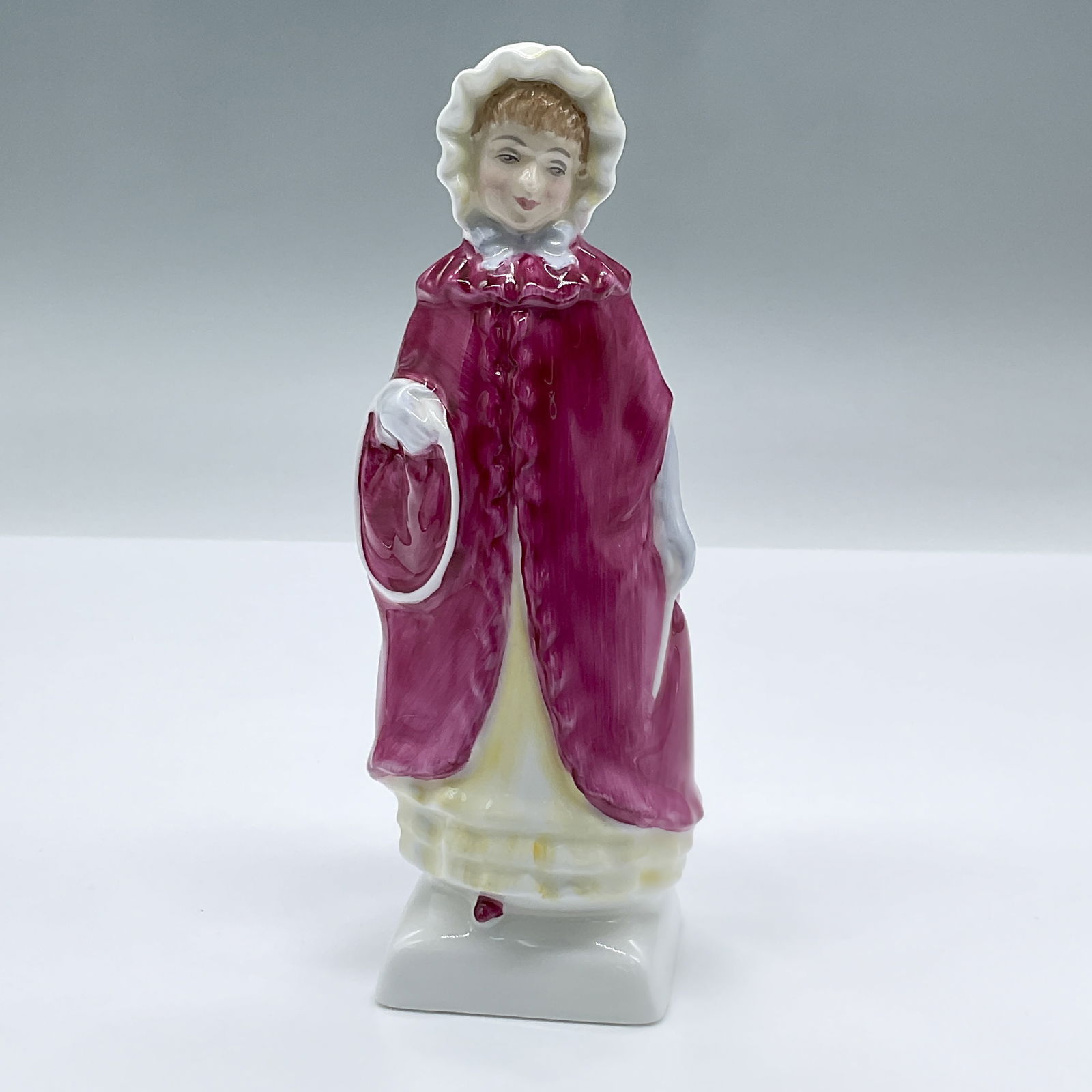 Georgina HN2377 - Royal Doulton Figurine: Adorable figure of a young girl in a Pink and yellow dress. Part of the Kate Greenaway series. Royal Doulton backstamp. Artist: Peggy Davies Issued: 1981 - 1986 Dimensions: 2.5"L x 2.25"W x 6"H Countr