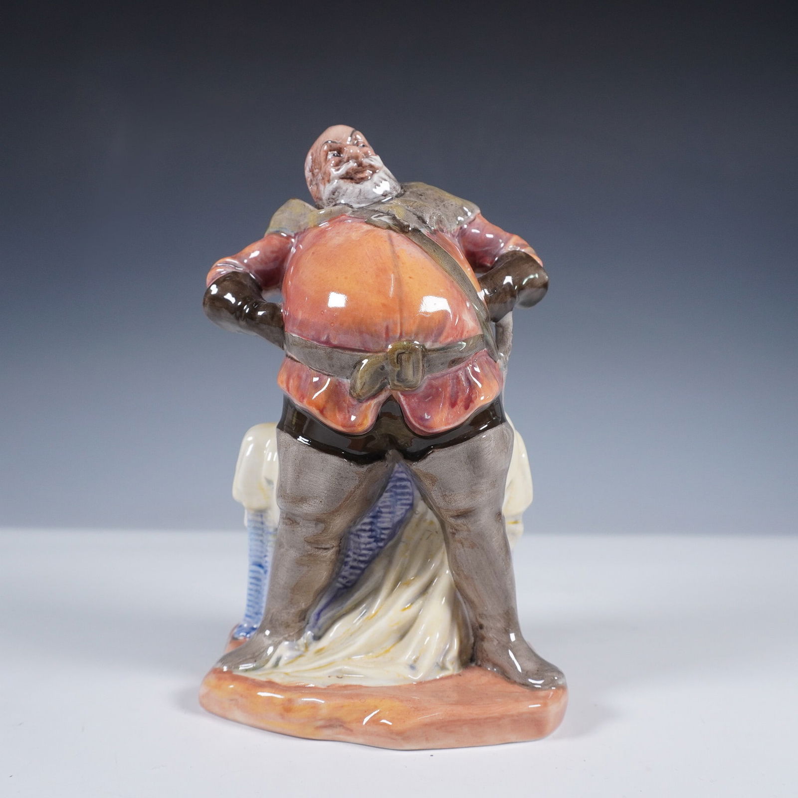 Royal Doulton Figurine, Falstaff HN2054: Royal Doulton figurine Falstaff, model HN2054, issued in 1949 and based on the iconic Shakespearean character. A rotund and jovial figure, Falstaff is depicted in a dramatic stance with hands on hips