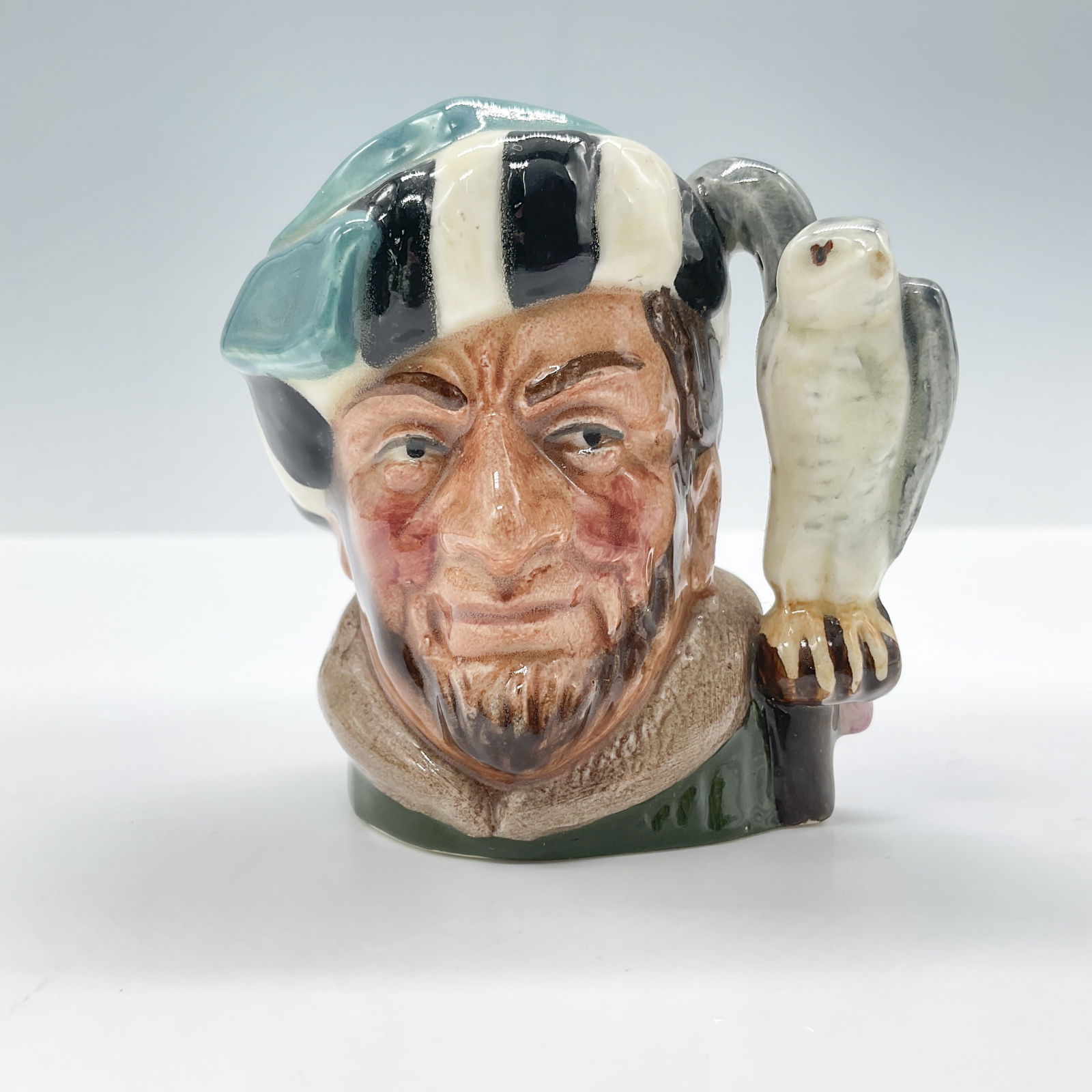 Falconer D6547 - Mini - Royal Doulton Character Jug: Royal Doulton backstamp. Artist: Max Henk Issued: 1960 - 1991 Dimensions: 2.75"H Country of Origin: England