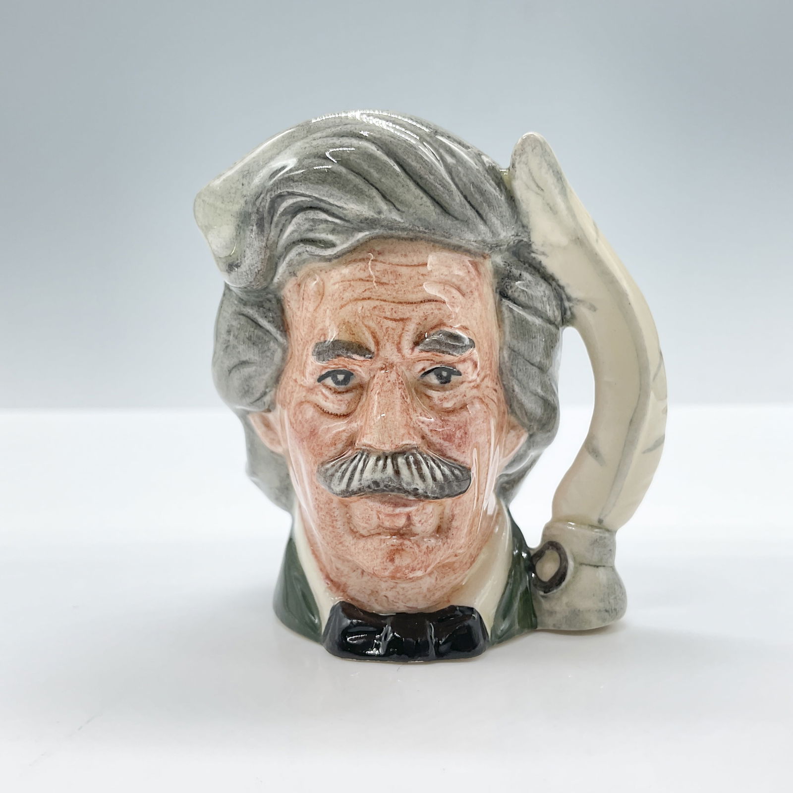 Mark Twain D6758 - Mini - Royal Doulton Character Jug: Royal Doulton backstamp. Artist: Eric Griffiths Issued: 1986 - 1990 Dimensions: 2.5"H Country of Origin: England