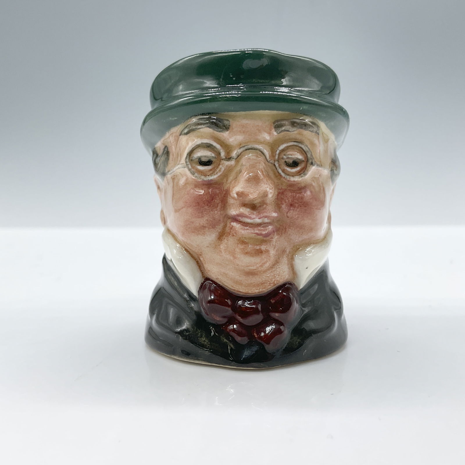 Mr Pickwick D6254 - Mini - Royal Doulton Character Jug: Royal Doulton backstamp. Artist: Leslie Harradine and Harry Fenton Issued: 1947 - 1960 Dimensions: 2.25"H Country of Origin: England