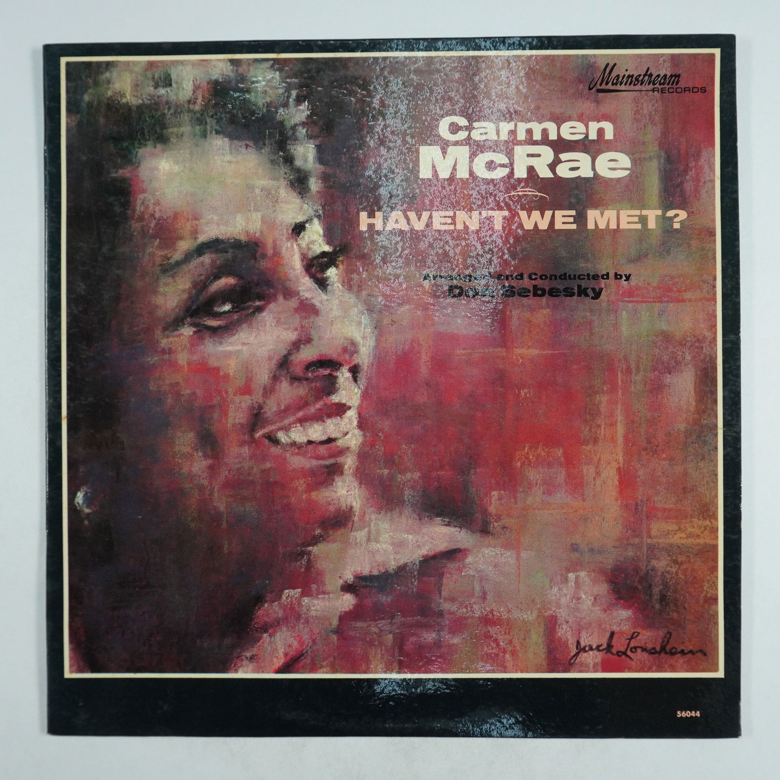 Carmen McRae Vinyl Record, Haven't We Met, Mainstream Records 56044: This lot features a vintage vinyl record of Haven't We Met by the legendary jazz singer Carmen McRae, arranged and conducted by Don Sebesky. Released on Mainstream Records (catalog number 56044), this
