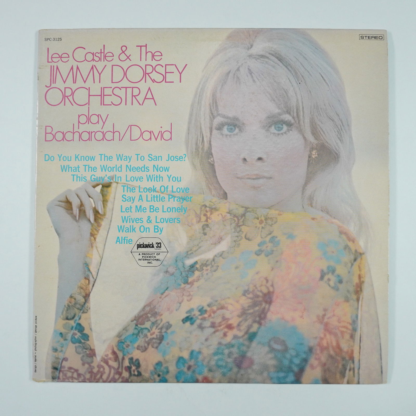 Lee Castle & The Jimmy Dorsey Orchestra LP: This vinyl LP features Lee Castle & The Jimmy Dorsey Orchestra performing a collection of classic songs by legendary songwriting duo Burt Bacharach and Hal David. Released under Pickwick Records (SPC-
