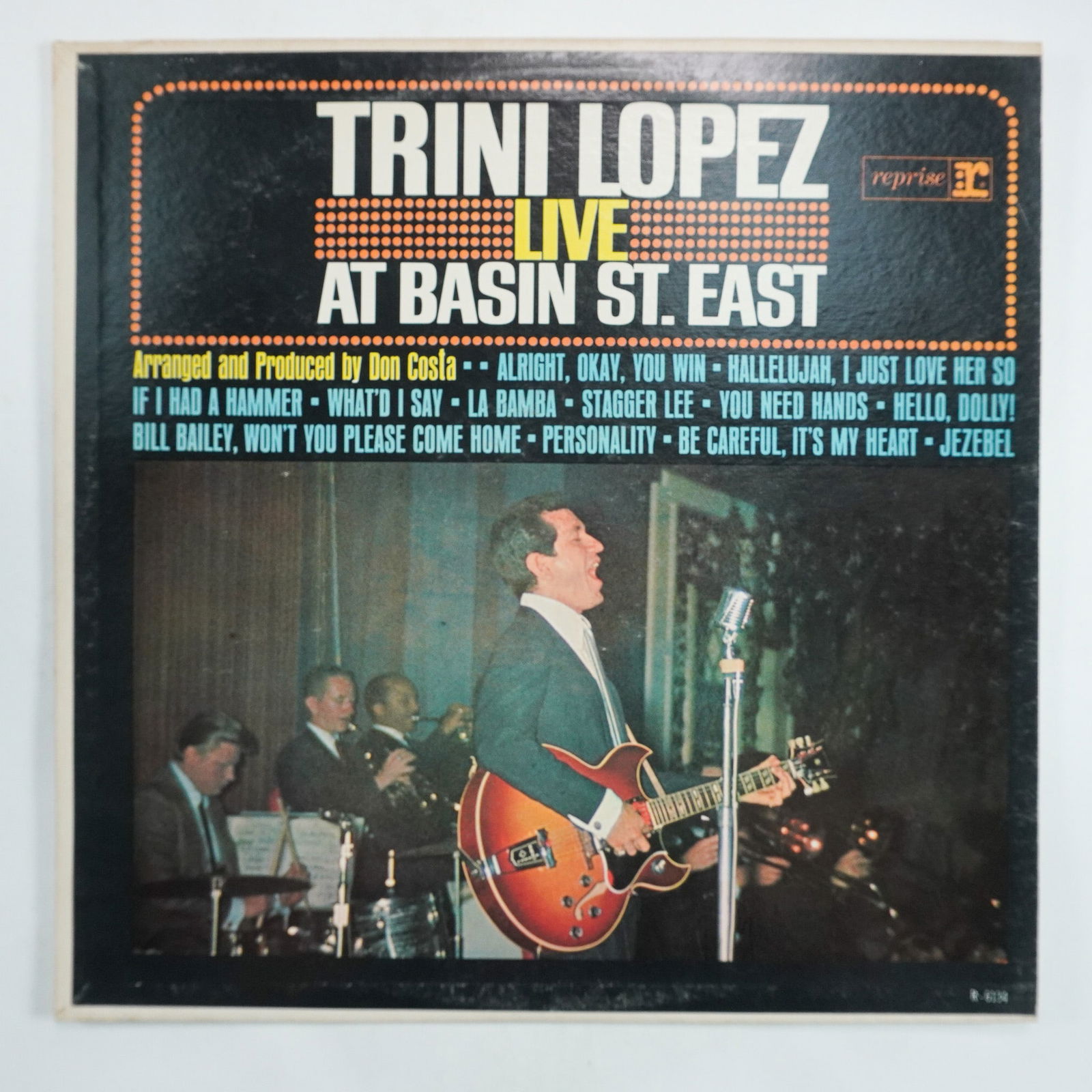 Trini Lopez, Live at Basin St. East Vinyl Record: Reprise Records R-6134 presents Trini Lopez Live at Basin St. East, a vibrant live album showcasing Lopez's energetic performance and signature sound. This record features hit songs including If I Had