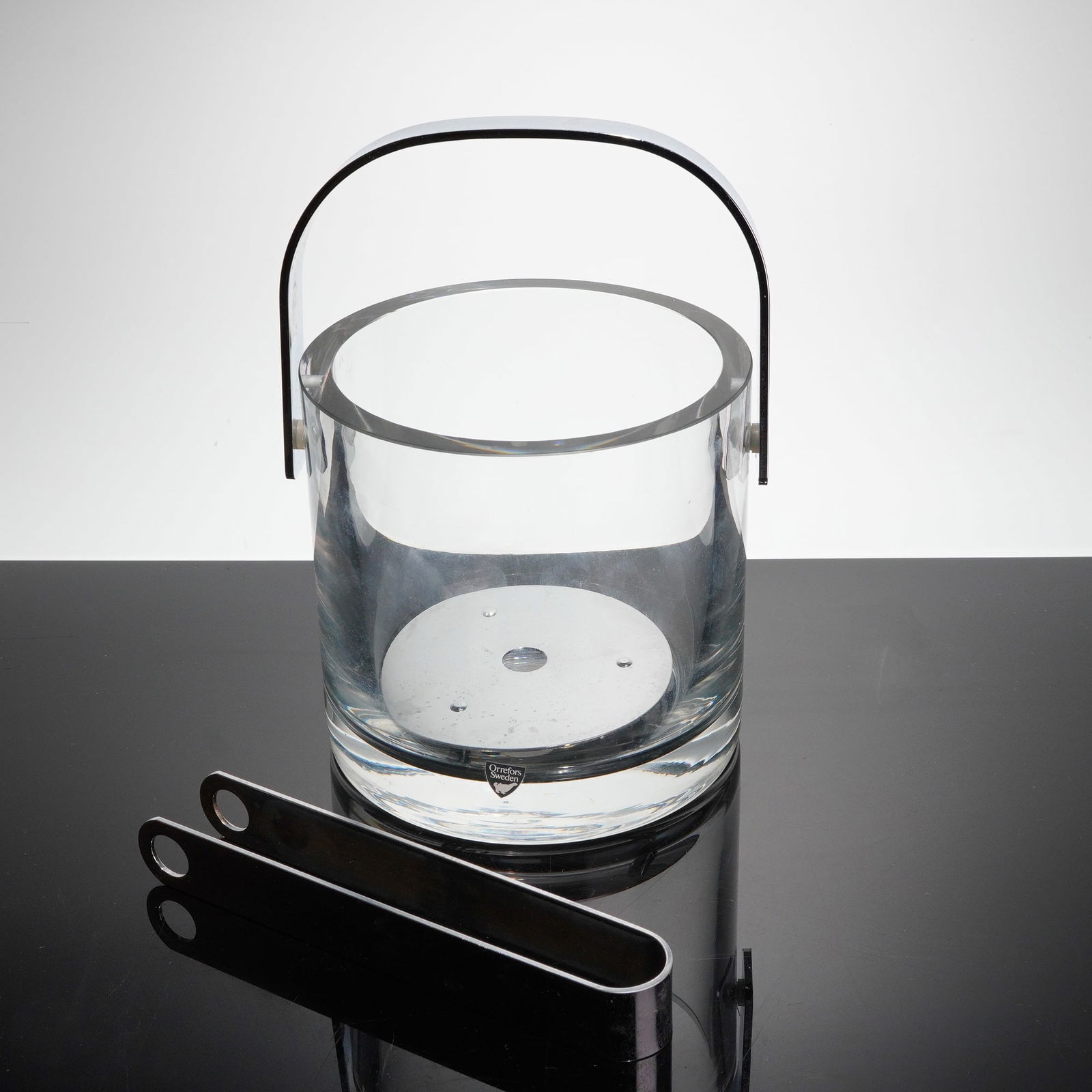 3pc Orrefors Sweden Mid-Century Modern Crystal Ice Bucket Set: A three-piece vintage ice bucket set manufactured by Orrefors Sweden, consistent with the modernist barware designs often atributed to the Erik or Sven lines. The set includes a heavy, thick-walled cy