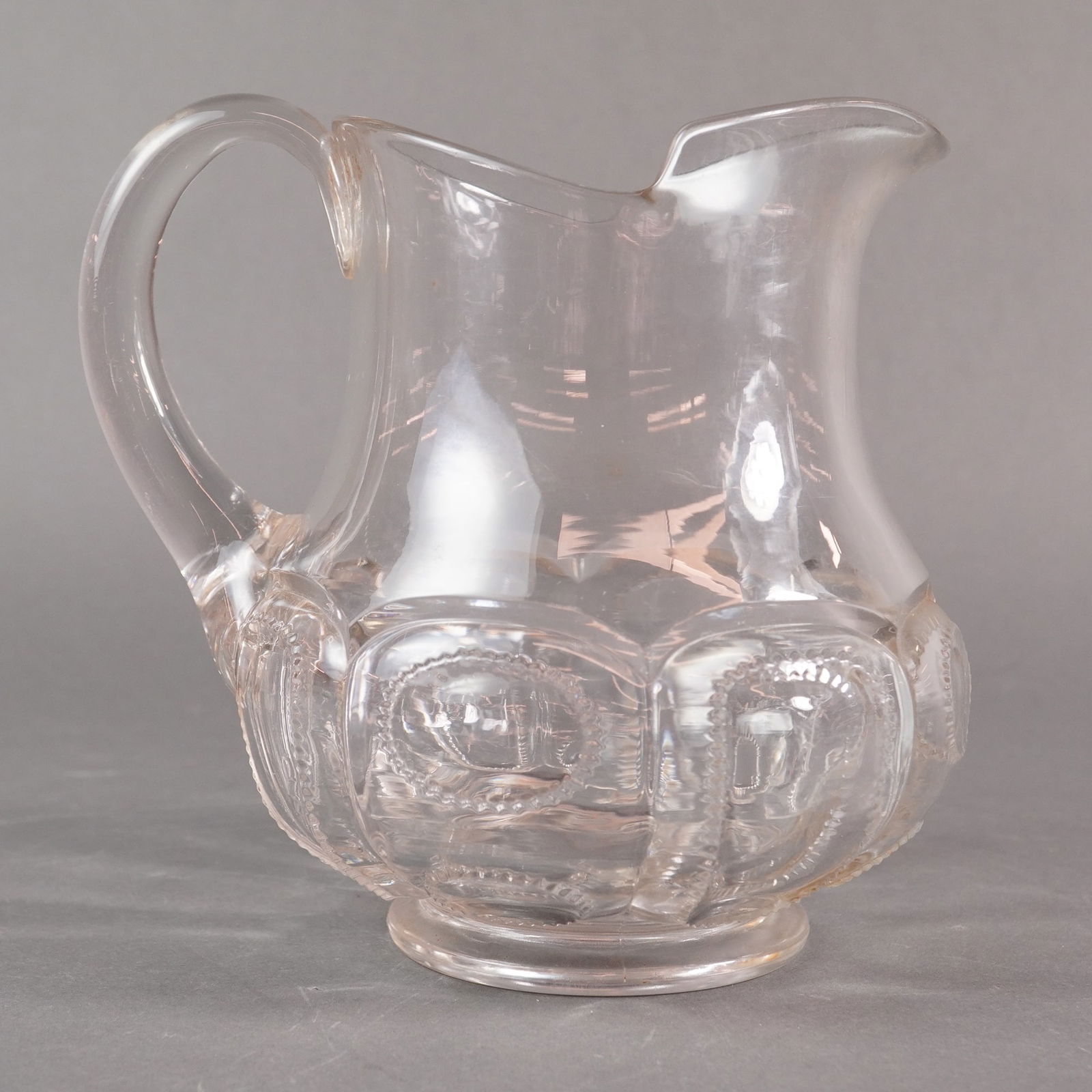 An Early American Pressed Glass (EAPG) Clear Medallion Pattern Pitcher (1 of 4)