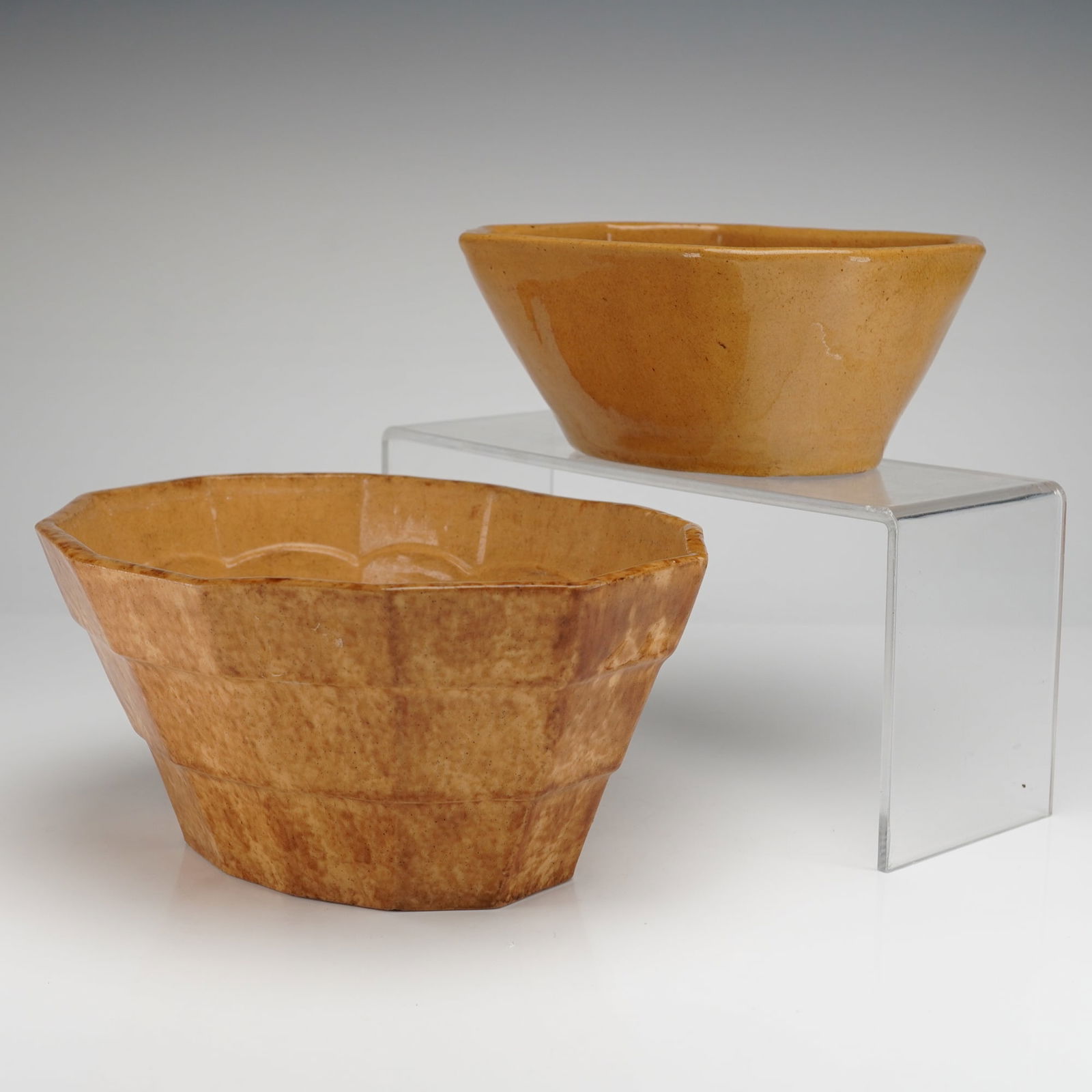 A Pair of Yellow Ware Pottery Baking-Jello Molds: A pair of antique ceramic food molds, commonly referred to as Yellow Ware or Treacleware, suitable for baking, pudding, or jello preparations. The 2pc set is formed from buff earthenware and covered i