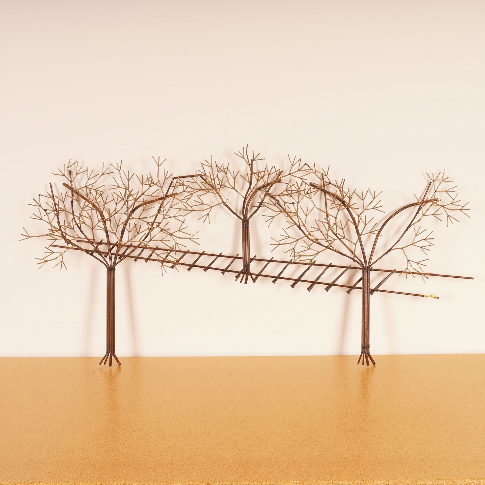 Robert Wiley, Welded Copper and Brass Tree Wall Sculpture, Signed: This mid century Brutalist wall sculpture by Robert Wiley features a striking composition of abstract trees crafted from welded copper and brass rods. The branching network of metal limbs creates a dy