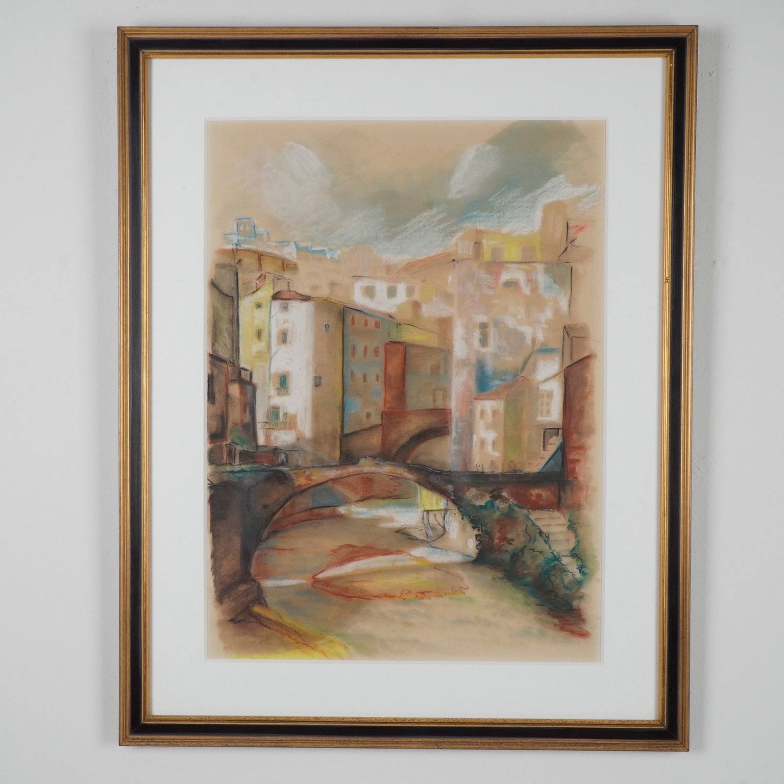 Original Pastel on paper, Cityscape with Bridge, Signed: Colorful pastel on paper made in an expressive style, featuring layered buildings and multiple arched bridges over a shallow river, rendered in a warm palette of ochres, reds, blues, and earth tones.