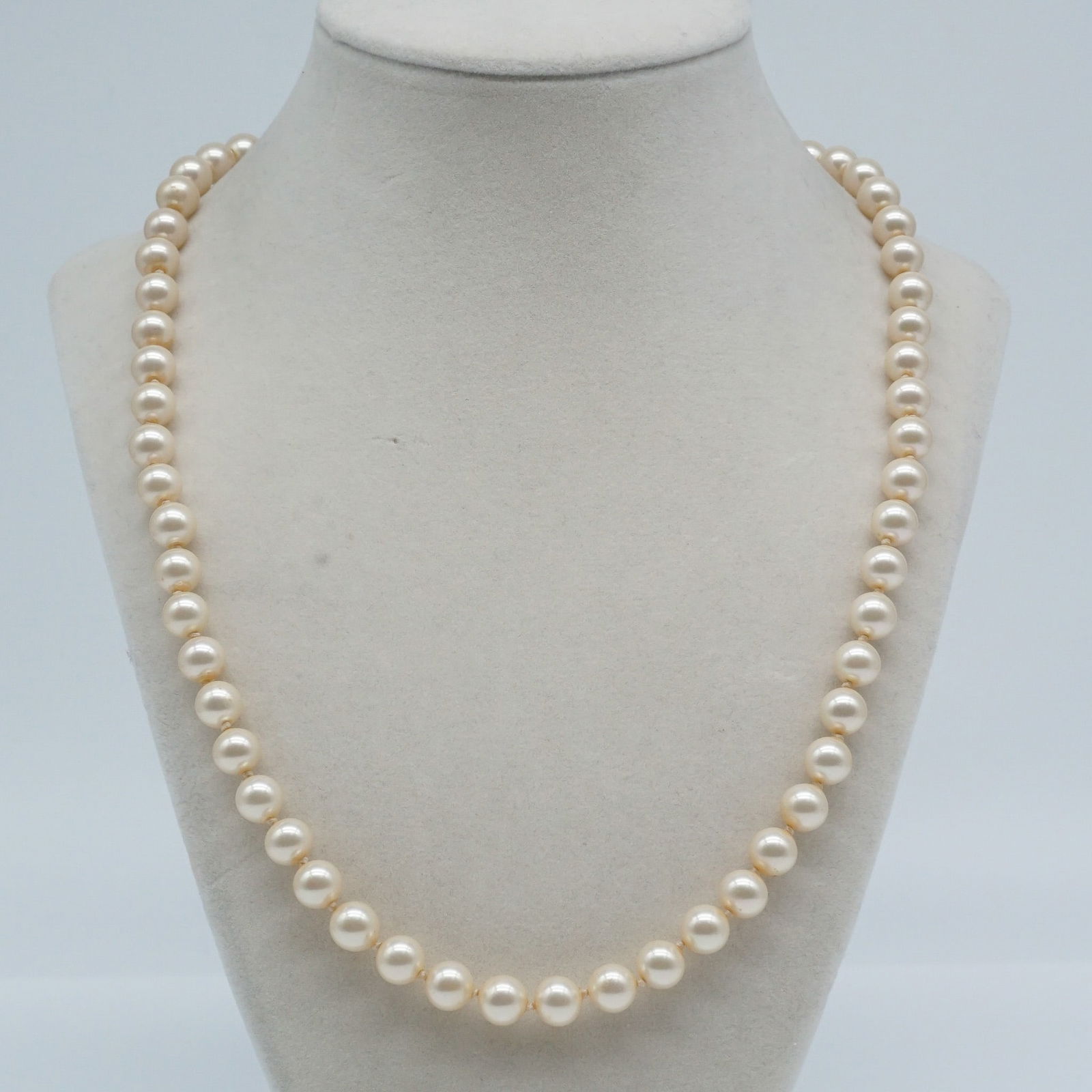 Cultured Pearls from Sarah Coventry With Sterling Clasp: Vintage Sarah Coventry pearl necklace featuring classic faux pearls strung on a 20-inch strand. The piece is completed with a sterling silver clasp, adding a refined touch to the elegant design. Known