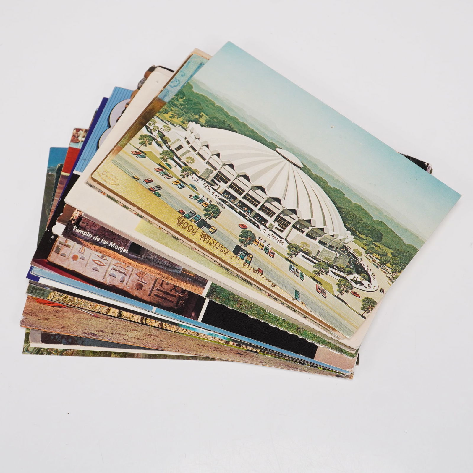 Collection of 28 Vintage Postcards including Landmarks, Holiday & Travel Sc: Group of approximately twenty-eight vintage postcards spanning a variety of themes and destinations. Subjects include landmarks such as the Iwo Jima Memorial, historic buildings, Christ the Redeemer i