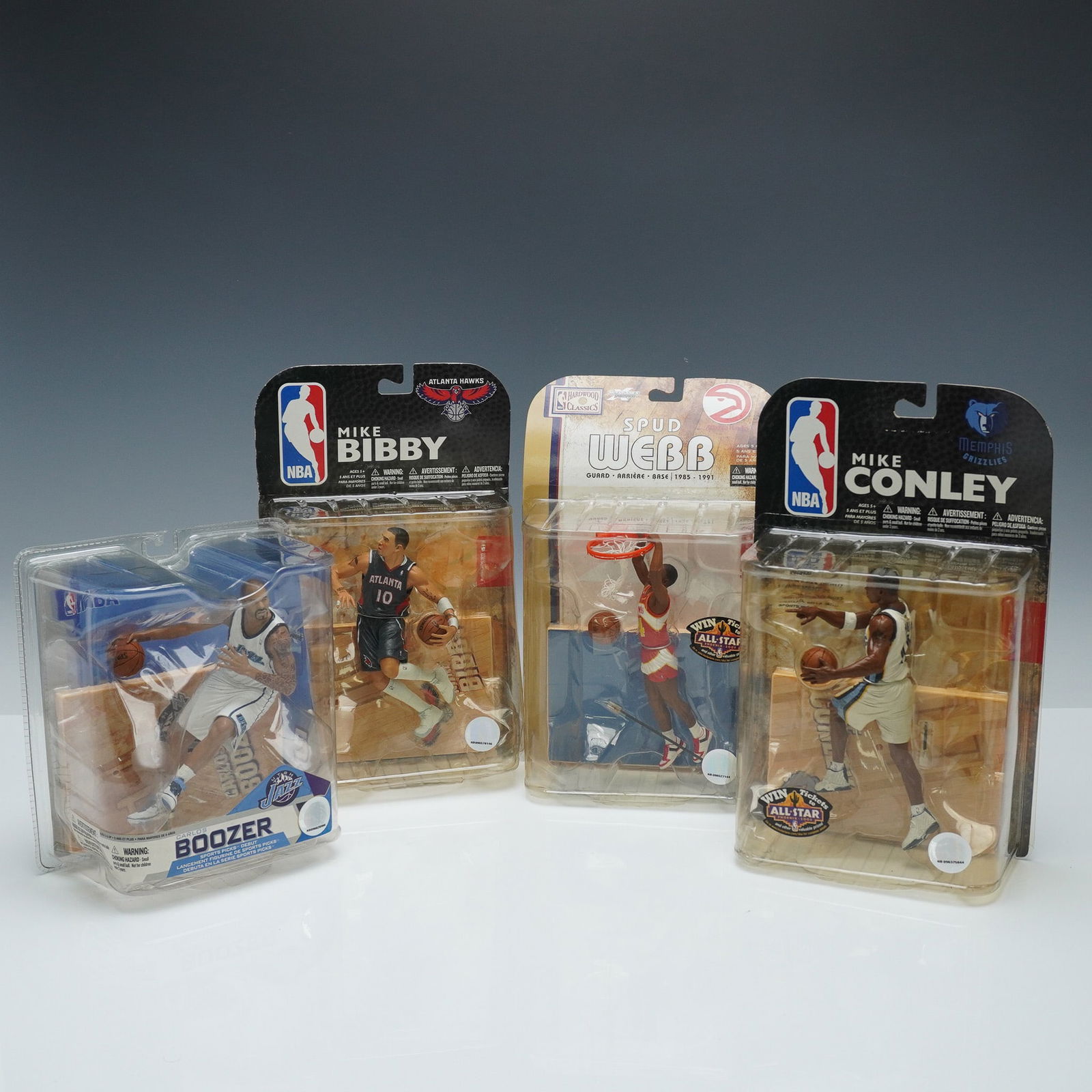 4pc McFarlane Toys NBA Action Figures, Boozer, Bibby, Webb, Conley: A set of four action figures, each sealed in original packaging. Includes Carlos Boozer from Utah Jazz, Mike Bibby from Atlanta Hawks, Spud Webb from Atlanta Hawks, and Mike Conley from Memphis Grizzl