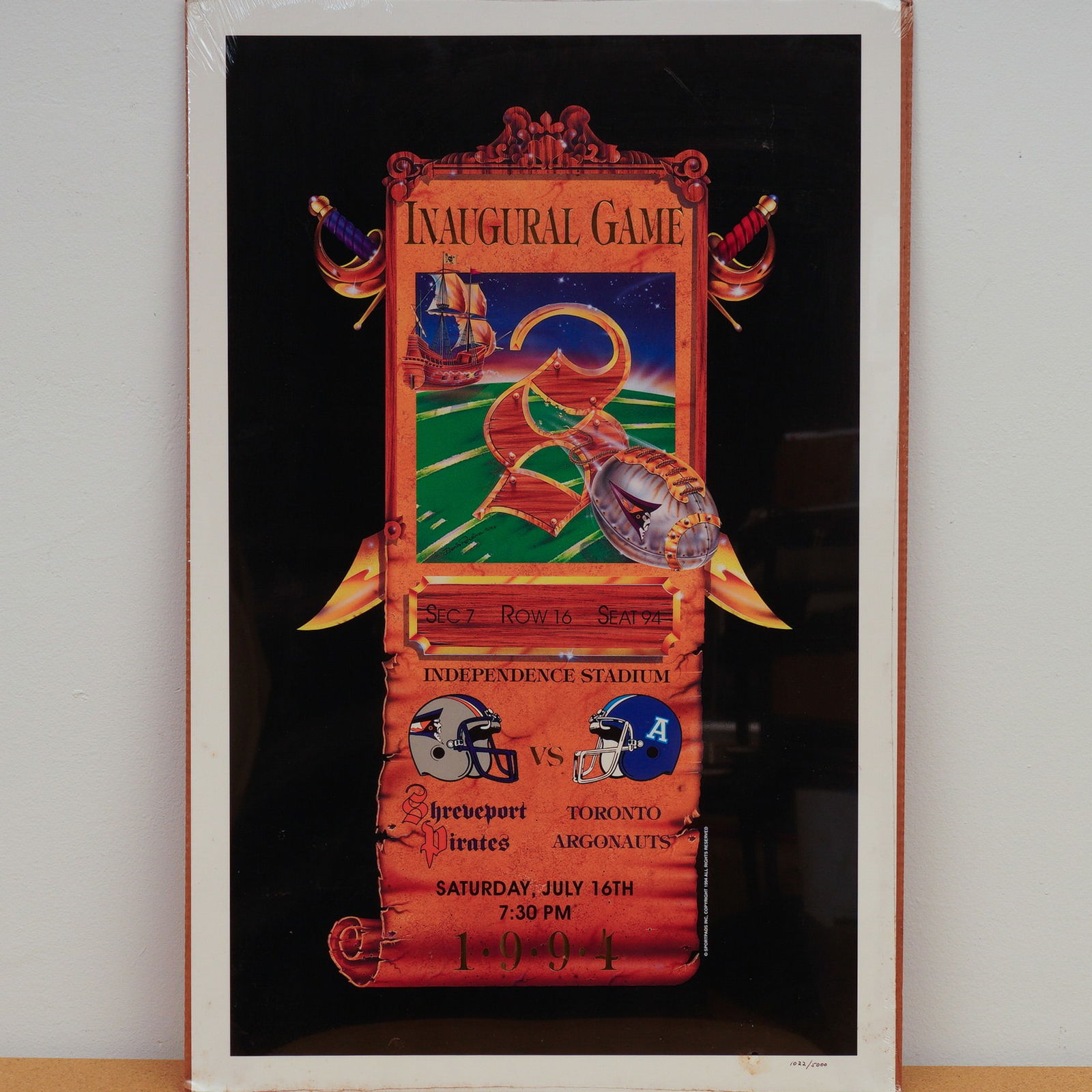 1994 Shreveport Pirates Inaugural Home Game Poster: Created for the Shreveport Pirates' first home game against the Toronto Argonauts on July 16, 1994, this limited edition poster showcases vibrant artwork by Denis Pereira featuring a pirate ship, foot