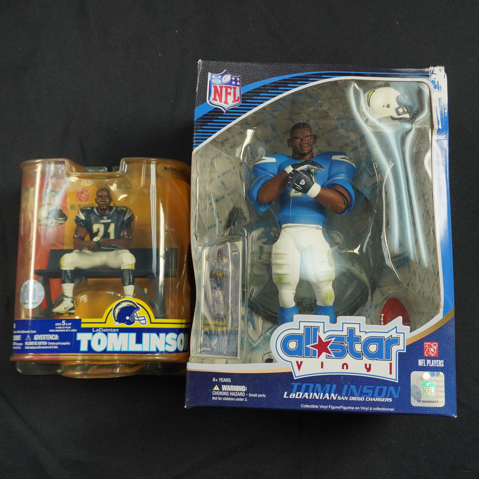 2pc LaDainian Tomlinson NFL Figurines: Pair of officially licensed NFL collectible figures representing legendary running back LaDainian Tomlinson. Includes one McFarlane figure of Tomlinson seated on a locker room bench in his Chargers un