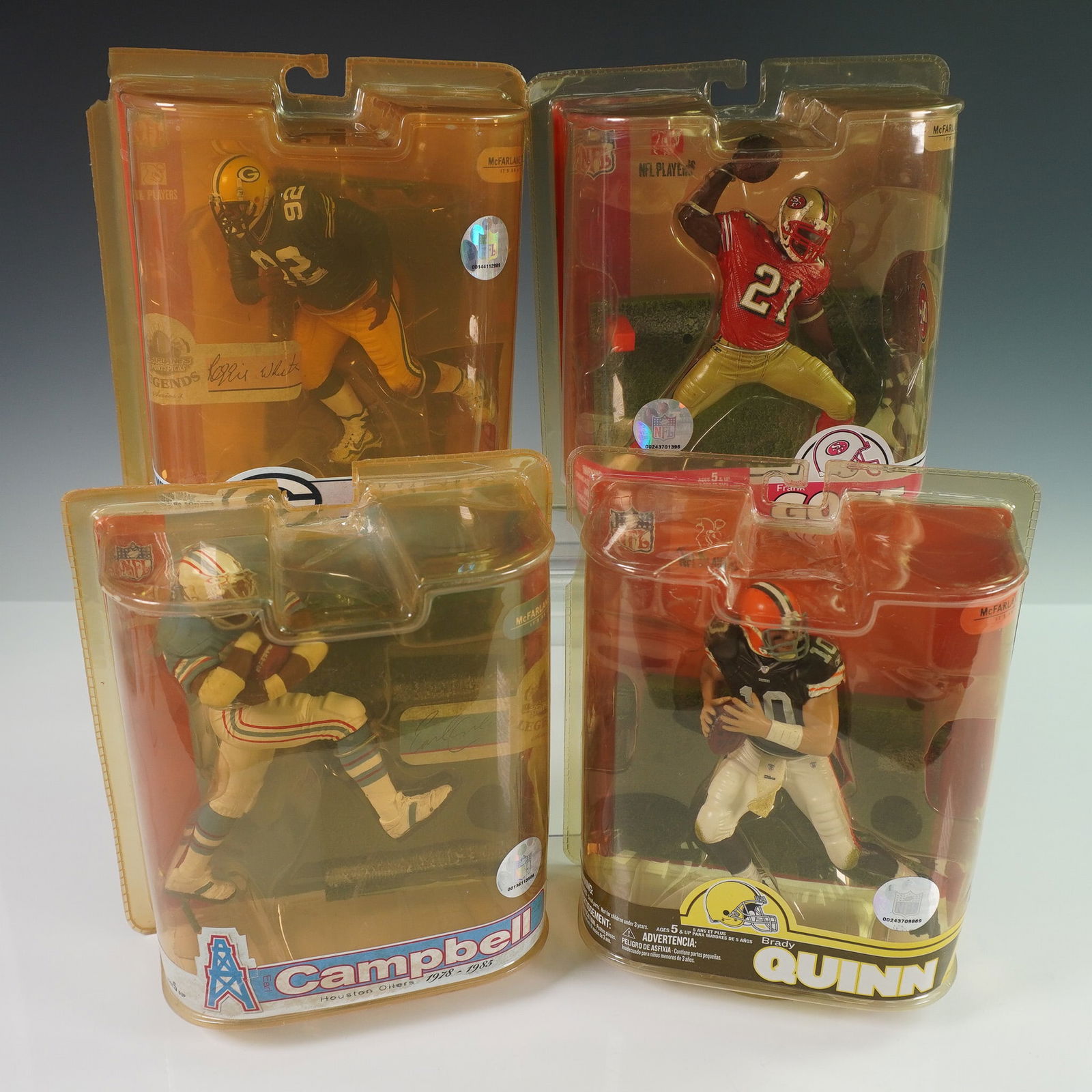 4pc McFarlane's SportsPicks NFL Action Toys: Set of four McFarlane SportsPicks NFL action figures, each in original unopened packaging. The collection features Reggie White of the Green Bay Packers (1993-1998), Frank Gore of the San Francisco 49