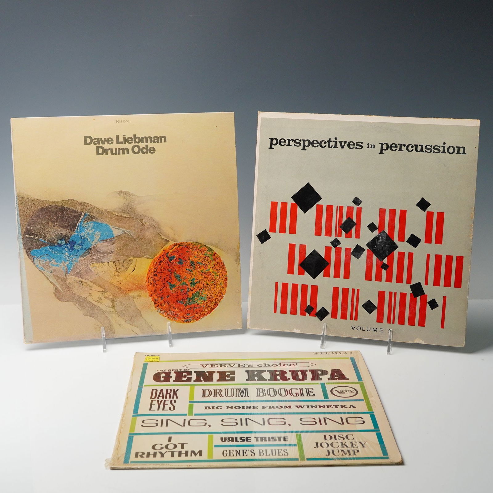 3pc Percussion Vinyl Records: Percussion-themed vinyl records showcasing influential works in jazz and experimental music. Includes "Drum Ode" by Dave Liebman from ECM Records, an album exploring rhythmic innovation with a modern