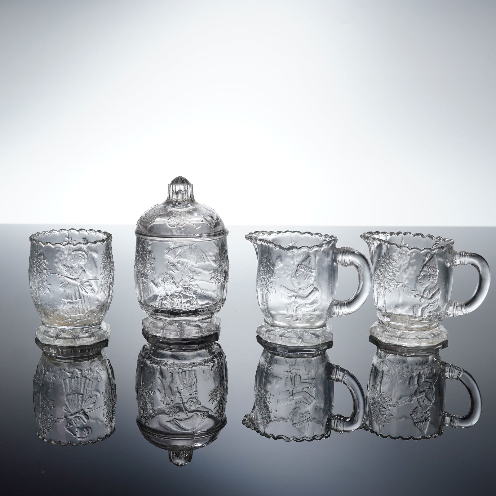 A Collection of Four EAPG Children's Nursery Rhyme Creamers & Bowls (1 of 3)