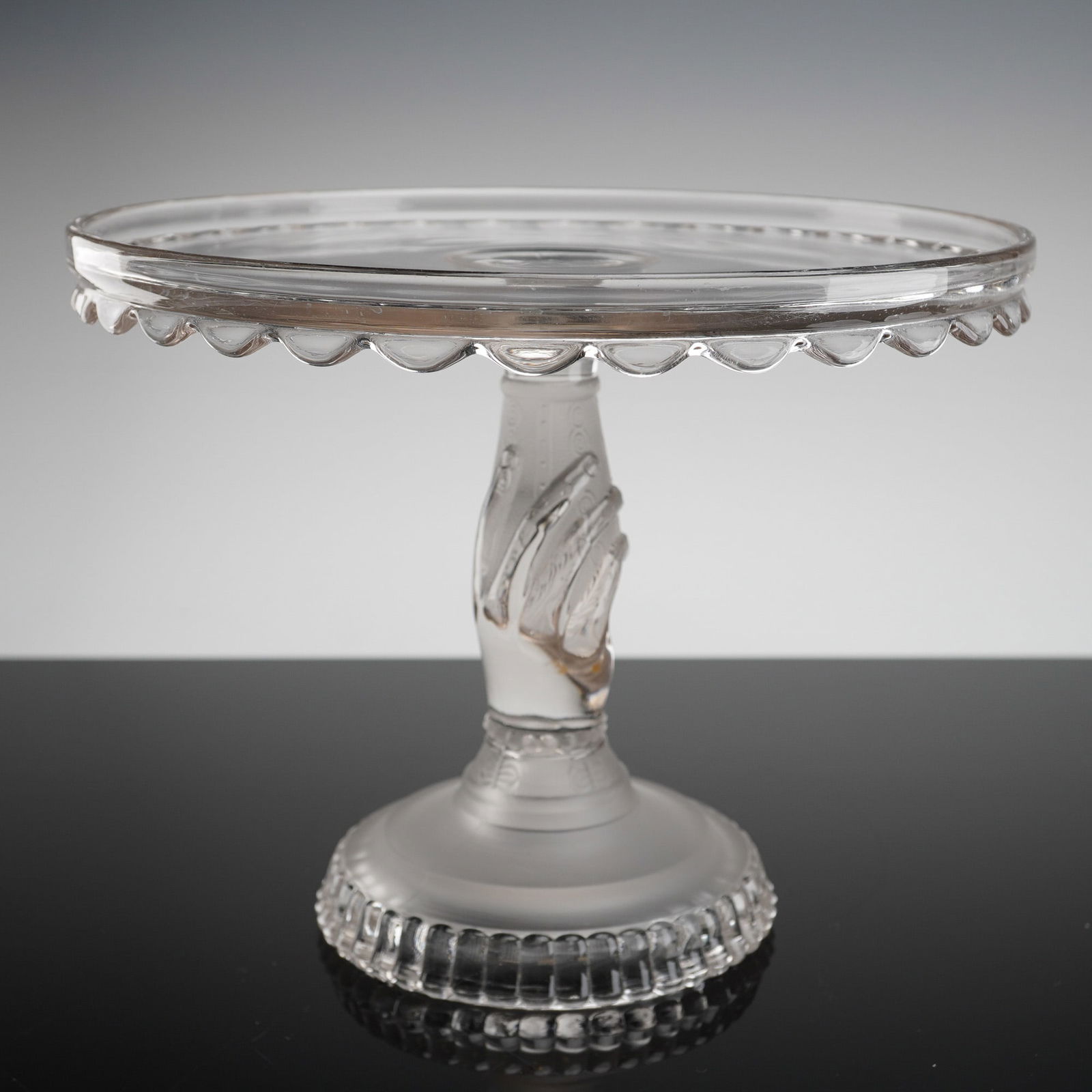 EAPG Hobbs Brockunier Tree of Life Pedestal Cake Stand: A single Early American pressed glass (EAPG) cake stand, attributed to Hobbs Brockunier & Co. in the Tree of Life pattern, featuring the distinctive hand pedestal. This Victorian-style piece is crafte