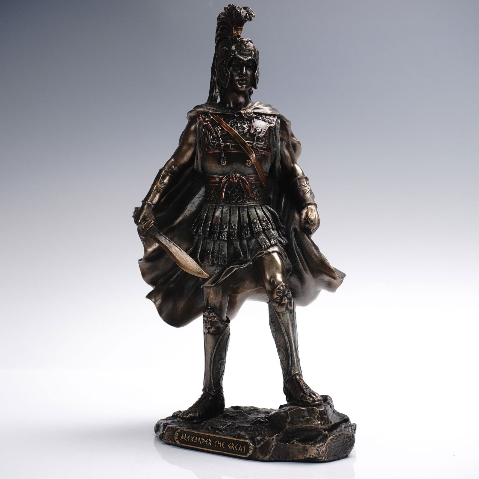 Veronese Cold Cast Bronze Figurine, Alexander the Great: Crafted by Veronese in 2019, this striking cold cast bronze figurine portrays Alexander the Great in full classical armor, sword in hand, standing atop a rocky base inscribed with his name. The sculpt