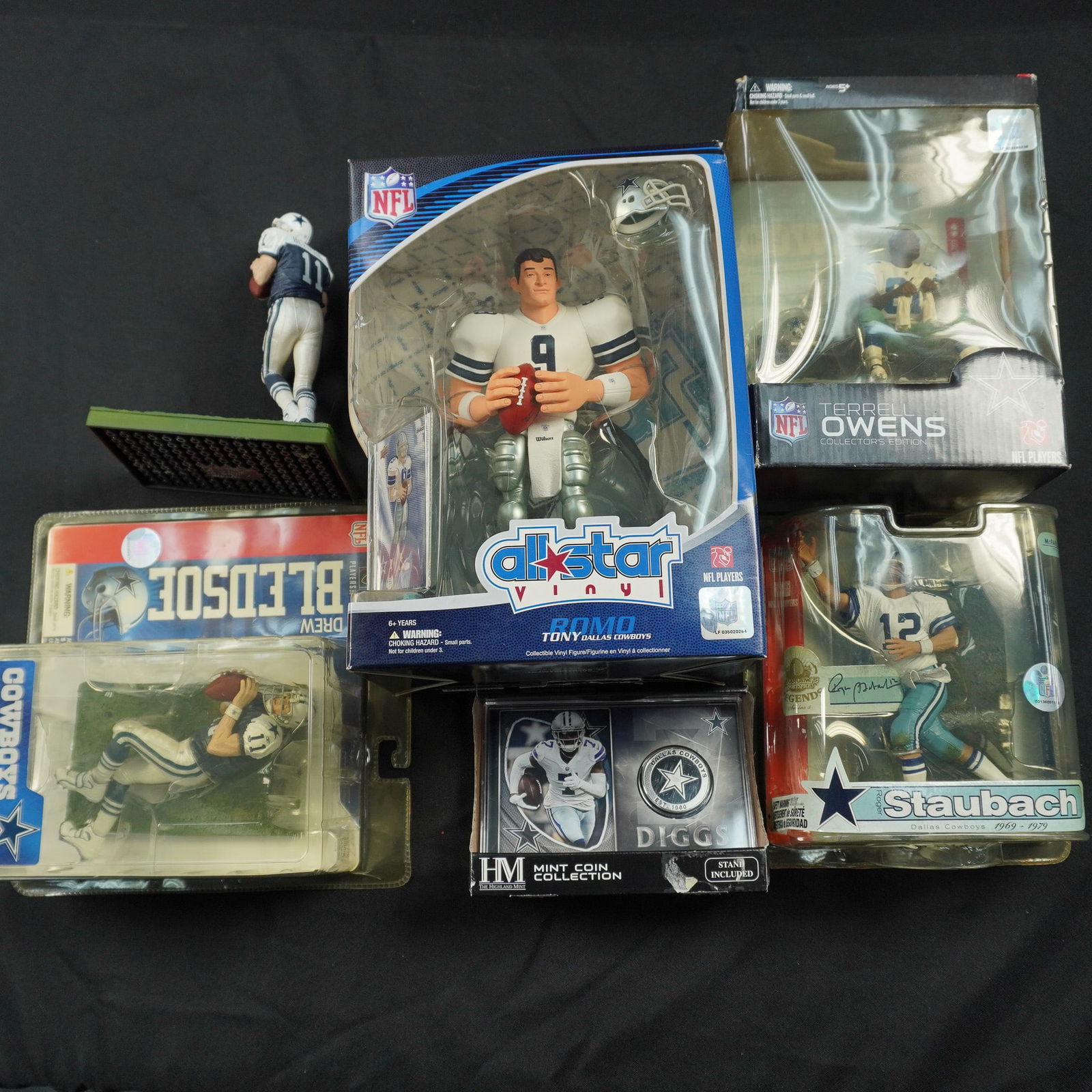 6pc Dallas Cowboys Collectible Figurines and Coin Set, Football: Celebrate the legacy of America's Team with this 6-piece Dallas Cowboys collectible set, featuring a lineup of legendary stars. The lot includes boxed and carded NFL action figures such as Terrell Owe