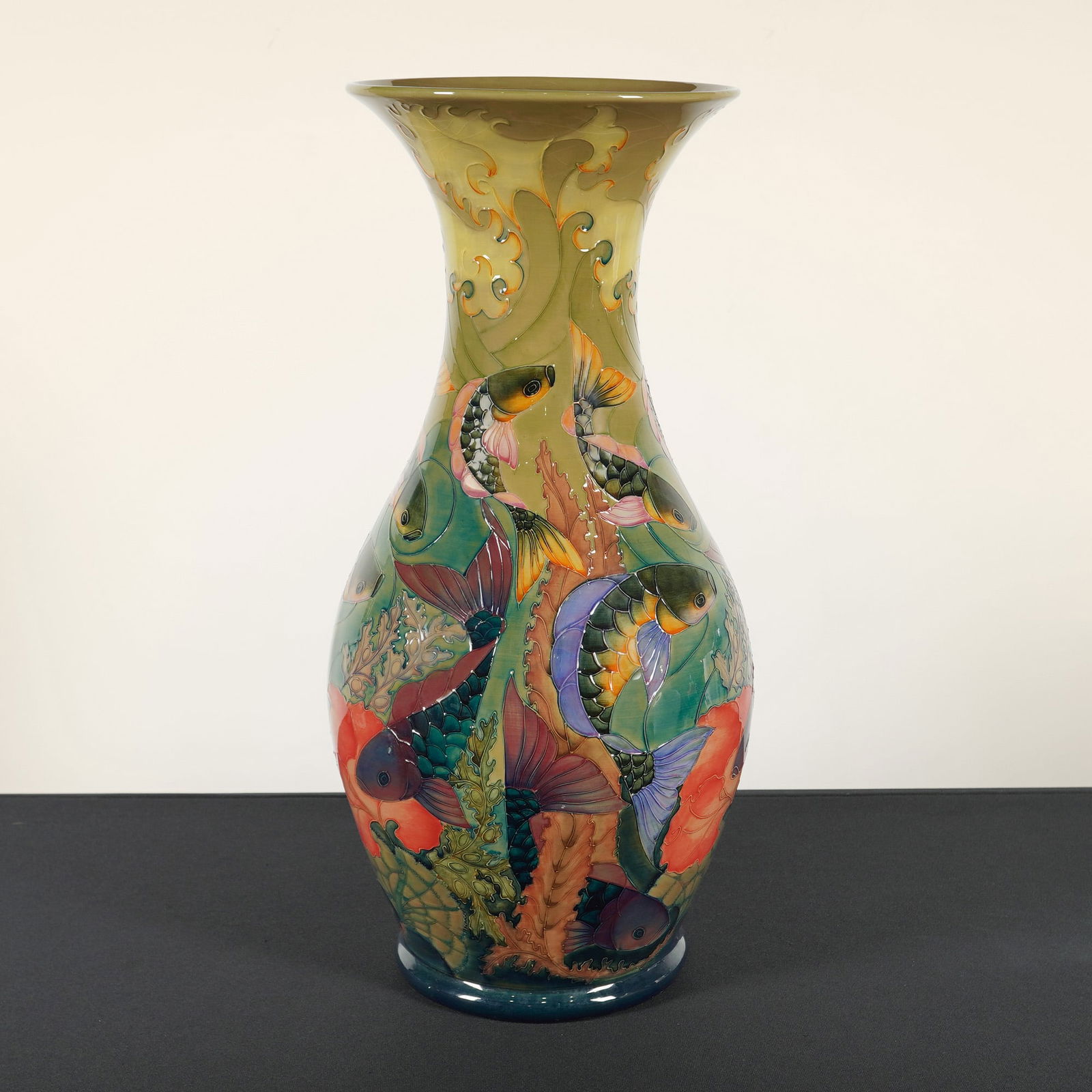 Moorcroft Pottery by Sally Tuffin Large Vase, Carp: Designed by Sally Tuffin (English, b. 1938) in 1992. Limited edition numbered 34 of 100. The large vase is decorated with fish and aquatic plants on a green ground. The underside bears impressed and p