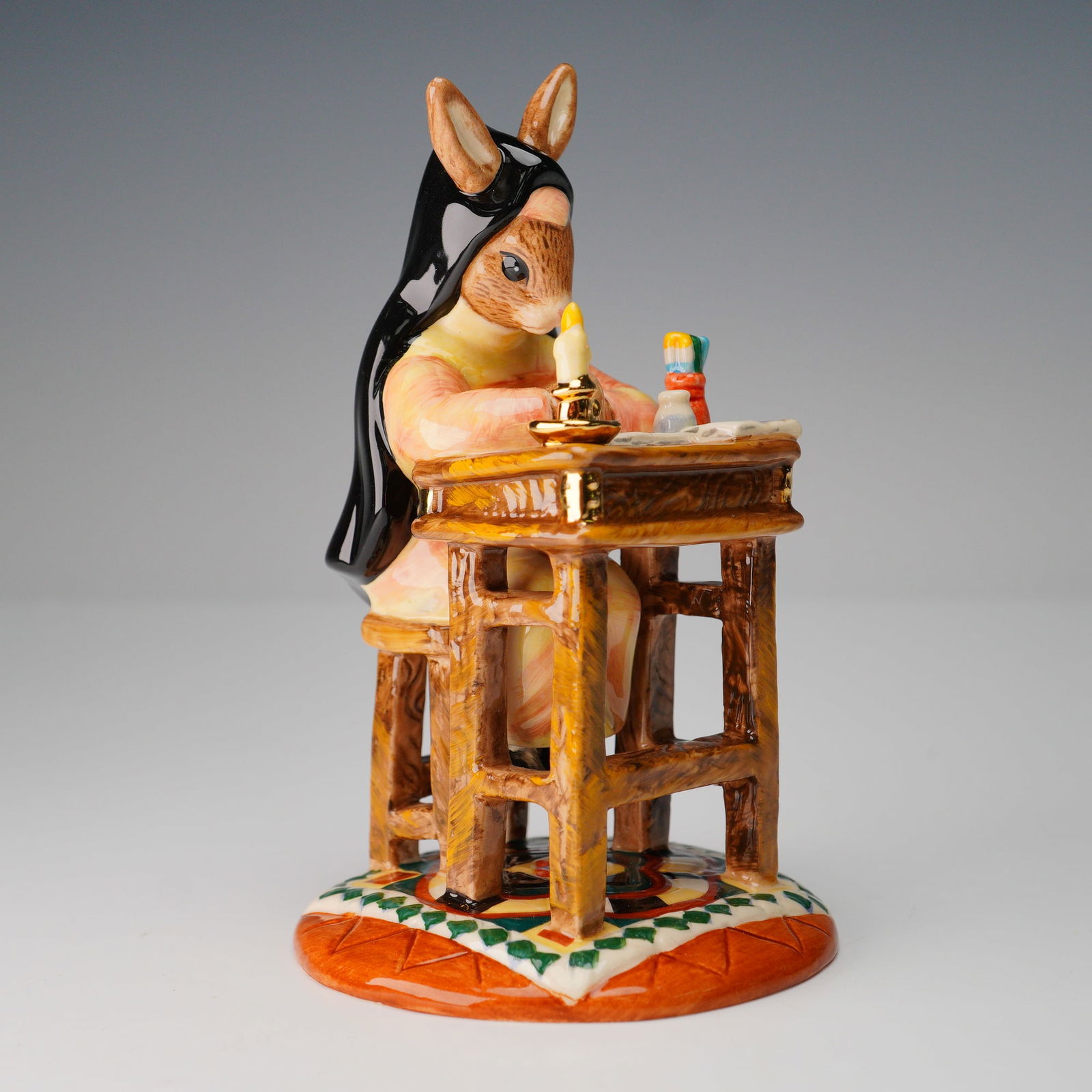 Royal Doulton Prototype Bunnykins, Sister Mary Barbara: Prototype bunnykins from Professions series. Features Sister Barbara seated; cream, black, tan, blue and red coloration. Prototype backstamp. Royal Doulton backstamp. Dimensions: 2.75"W x 4.75"H Count