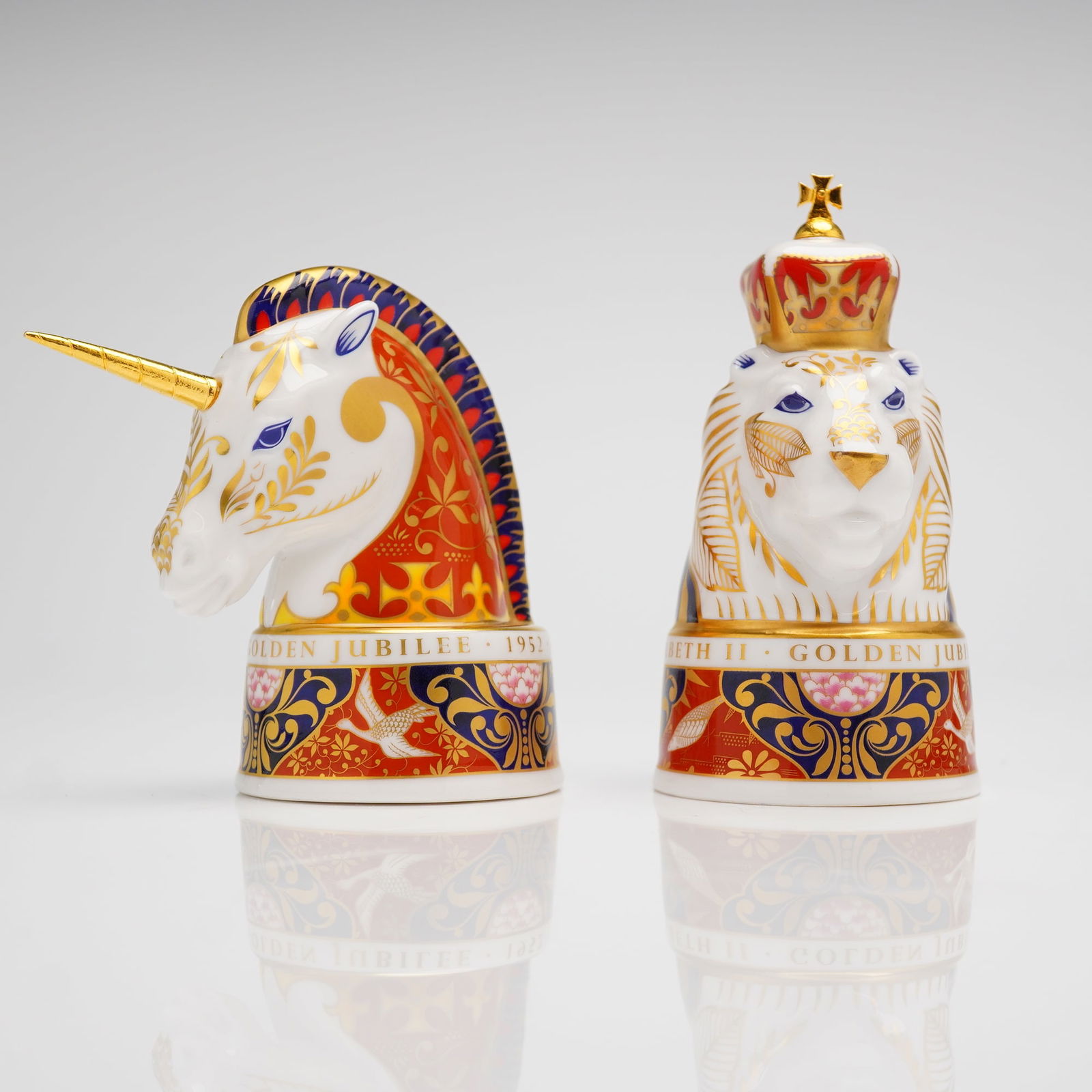 Pair of Royal Worcester Golden Jubilee Lion & Unicorn Candle Snuffers: A pair of Royal Worcester limited edition bone china candle snuffers, commemorating the Golden Jubilee of Queen Elizabeth II (1952-2002). The snuffers are molded in the form of the heraldic Lion and U