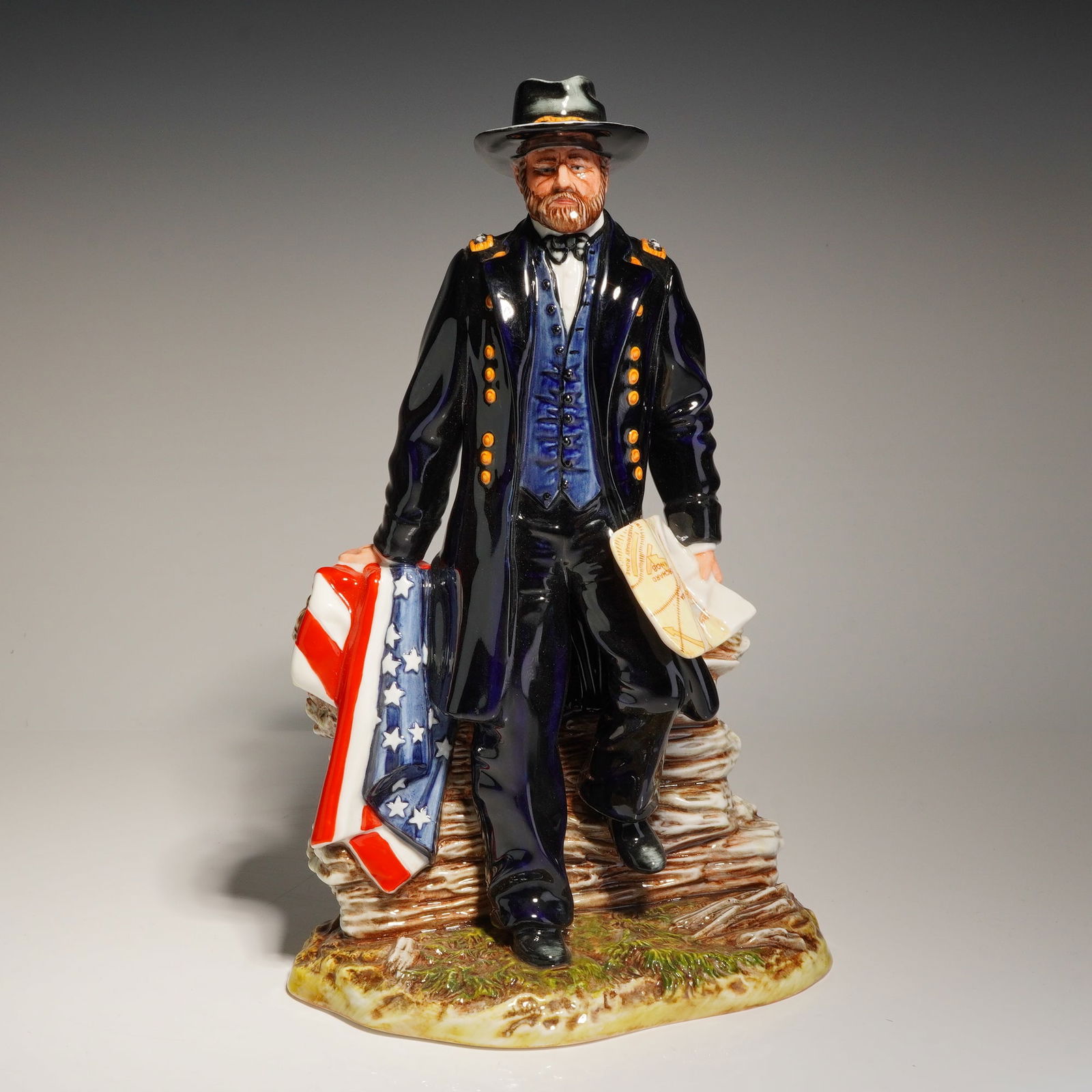 Royal Doulton Figurine, Lt. General Ulysses S. Grant HN3403: This hand-decorated fine china figure was issued in 1992. The subject is depicted in a dark blue Union officer uniform with gold-toned buttons and shoulder boards, a blue vest, and a black wide-brimme