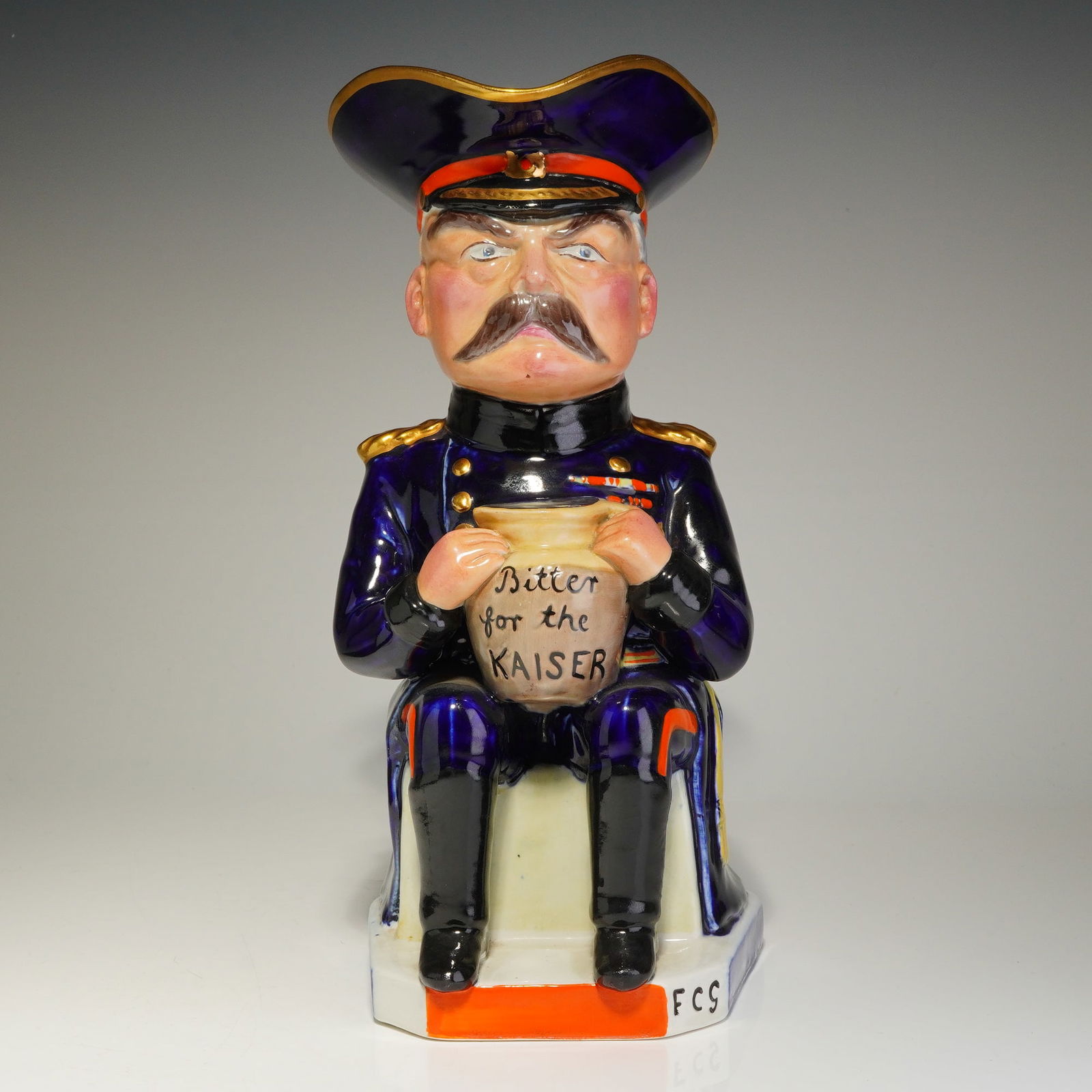Royal Staffordshire Pottery Wilkinson Toby Jug, Lord Kitchener: Designed by Carruthers Gould, a glazed earthenware toby jug modeled as Field Marshal Horatio Herbert Kitchener, 1st Earl Kitchener, one of Britain's most iconic military figures of the early 20th cent