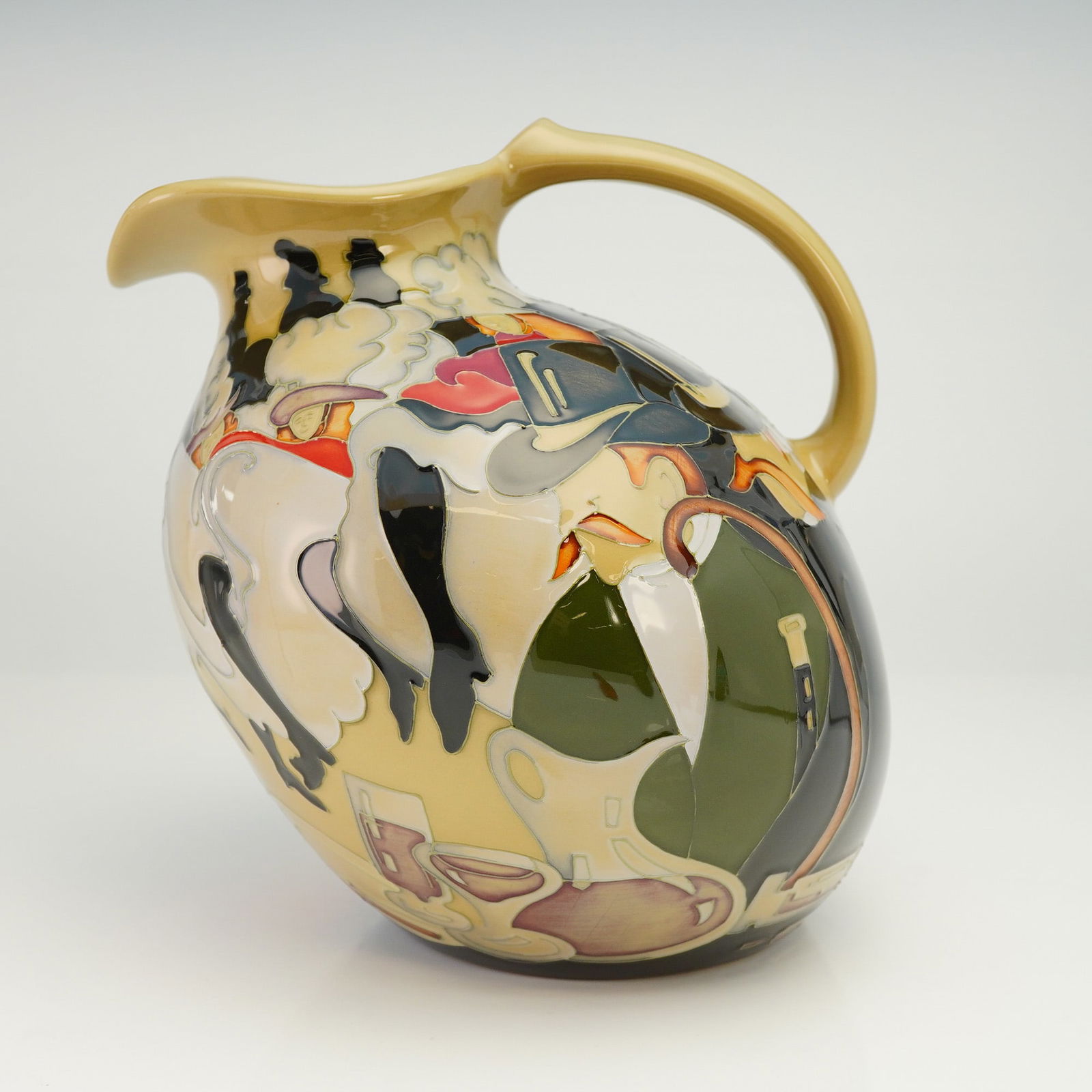Moorcroft Pottery by Emma Bossons Jug, Pigalle: Pottery jug has bulbous shape with a pinched spout. Tube-lined design of Can-can dancers and host colored in black, green and red over cream background. Moorcroft backstamp along with artist signature
