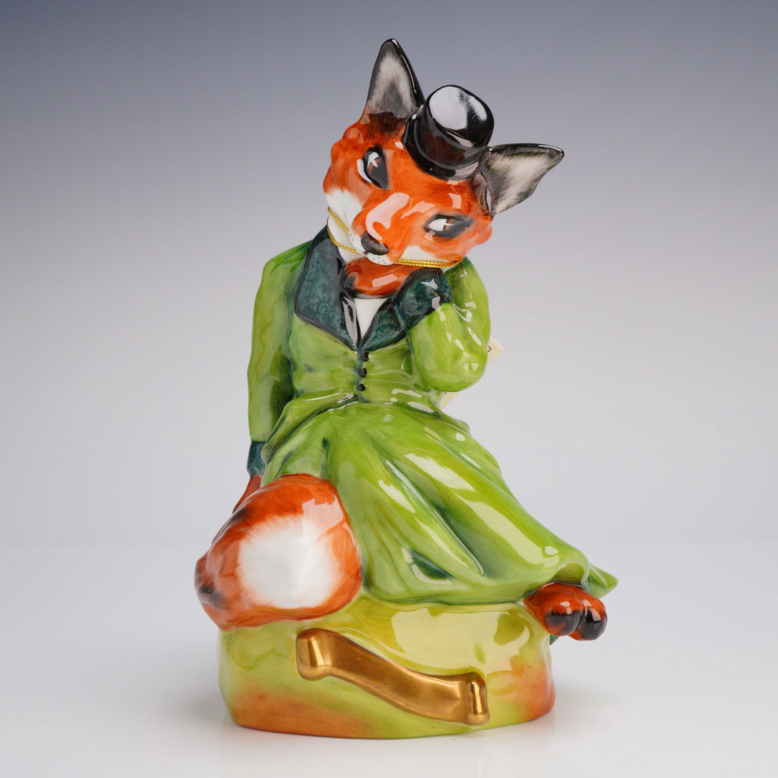 Royale Stratford Hand Painted Bone China Figurine, Mrs. Fox: A single, highly glazed bone China figurine by Royale Stratford Staffordshire & Chelsea, hand painted and made in England. The anthropomorphic figure depicts a fox styled as a female dandy, wearing a