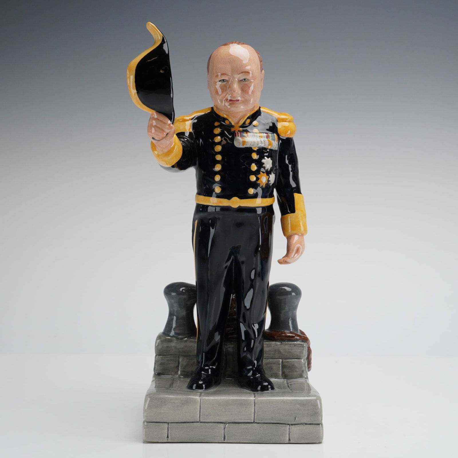 Bairstow Manor Winston Churchill Lord Warden Figurine: A single glazed ceramic figurine by Bairstow Manor Collectables, part of The Life and Times of Winston Churchill series. This figurine depicts Sir Winston Churchill as the Lord Warden of The Cinque Po