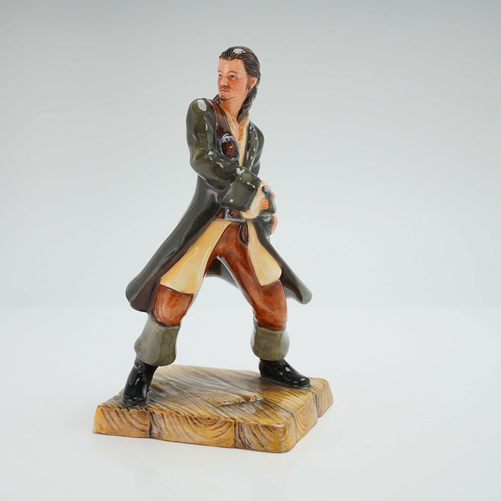 Royal Doulton Prototype Pirates of the Caribbean Figurine, Will Turner: Depicting the character Will Turner from the 2003 motion picture "Pirates of the Caribbean: The Curse of the Black Pearl." The figure is modeled in a dynamic action pose and finished in a palette cons