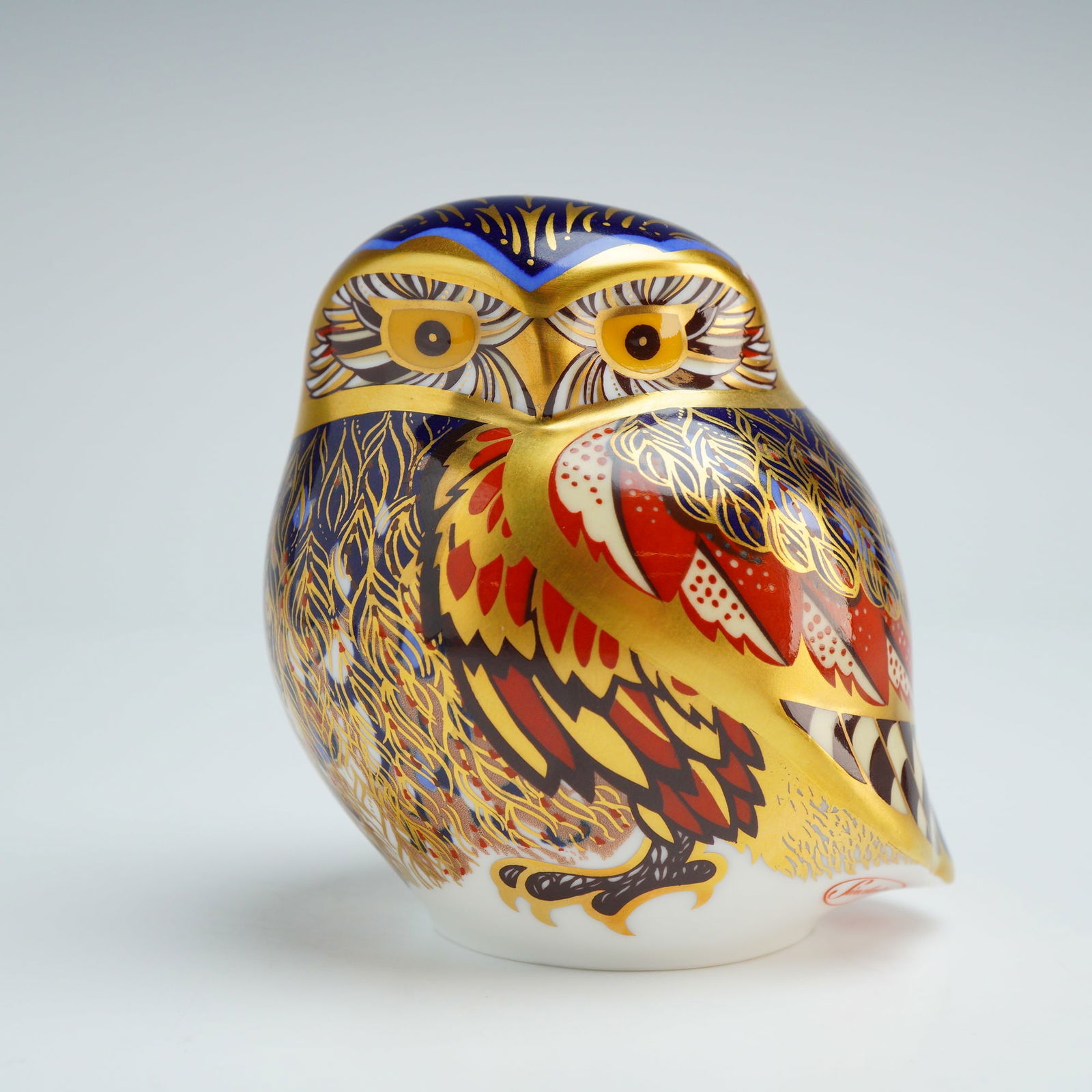 Royal Crown Derby Paperweight, Little Owl - Signed: A Royal Crown Derby decorated in a traditional Imari style with a palette of cobalt blue, iron red, and 22kt gold gilding. This piece is an Exclusive Signature Edition produced for Sinclairs and featu