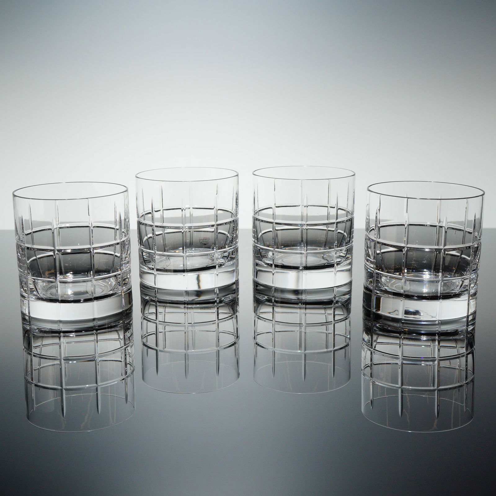 Orrefors Street Crystal Double Old Fashioned Glasses Set of 4: A set of four Orrefors Street crystal double old-fashioned (DOF) glasses, accompanied by their original branded matte black packaging box. The cylindrical glasses are crafted from heavy, clear crystal