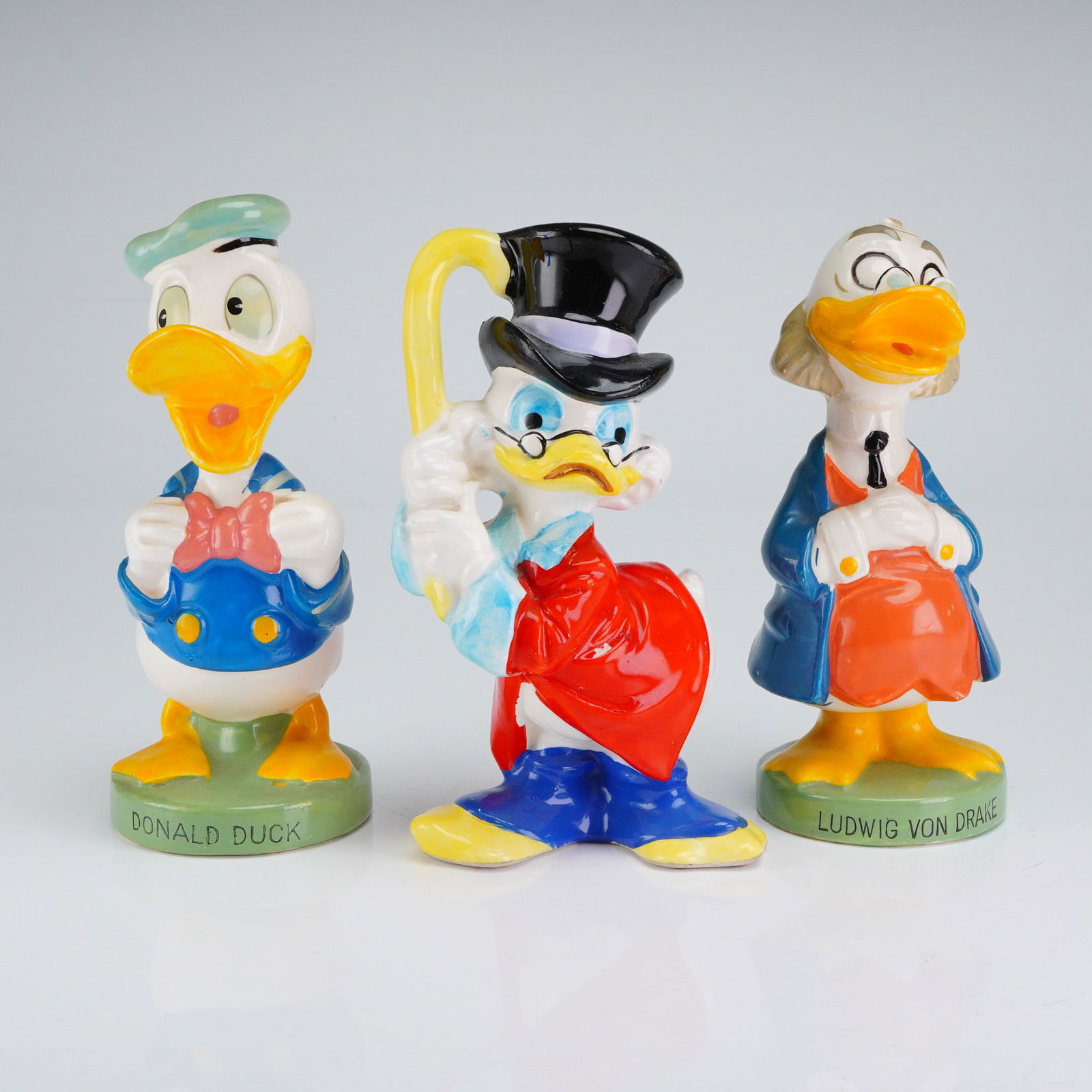 3 Disney Ceramic Shaker Set - Donald Duck, Von Drake & Scrooge McDuck: A rare 3-piece set of vintage Walt Disney's ceramic shaker figures featuring three iconic characters from the Duck universe. The collection includes Donald Duck, Professor Ludwig Von Drake, and the ce