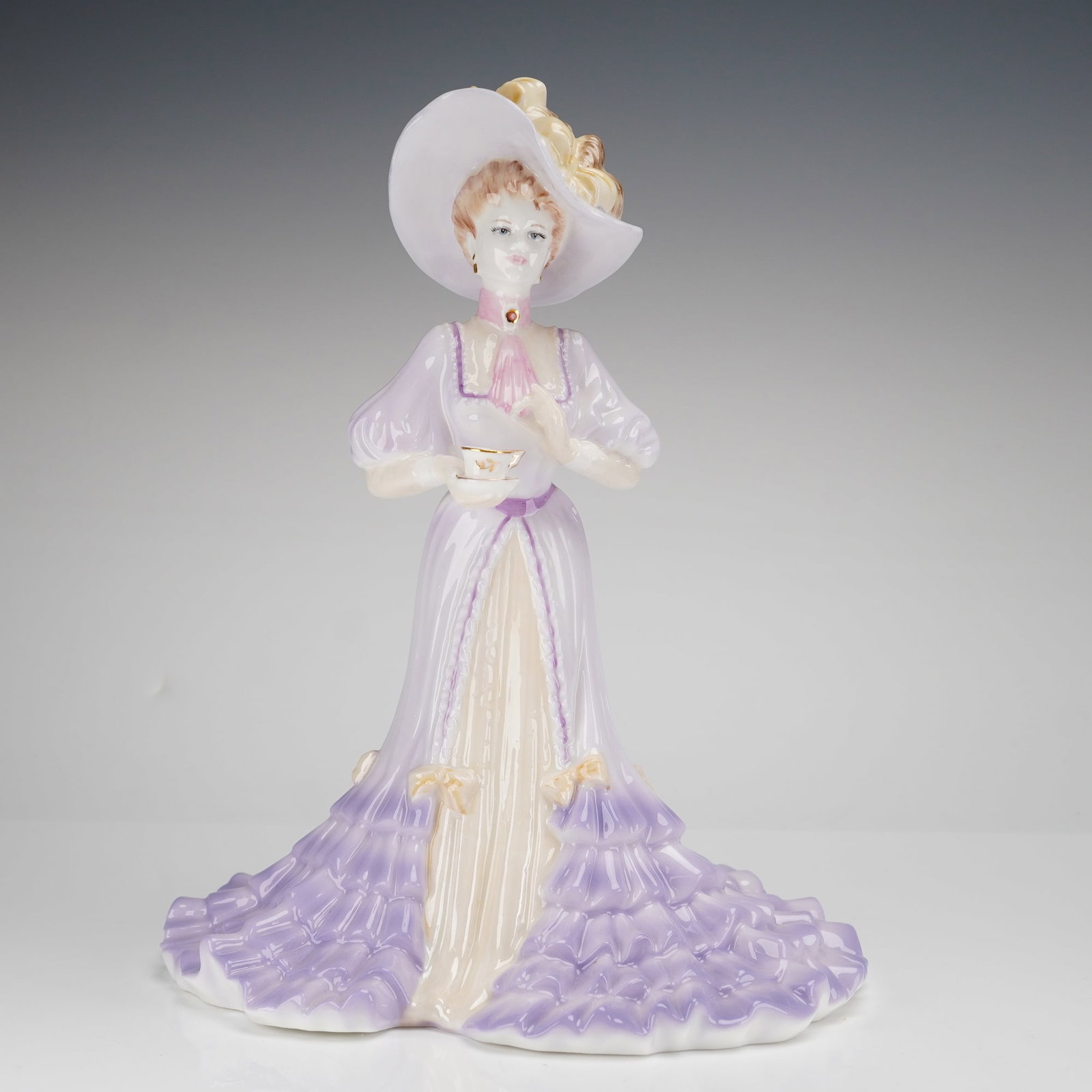 Coalport High Society Figurine, Lady Elizabeth: This limited-edition piece, numbered 1159 of 5,000, was produced in England in 1997 and modeled by Jack Glynn. The figure is depicted in Edwardian-style attire, wearing a lavender and cream gown with