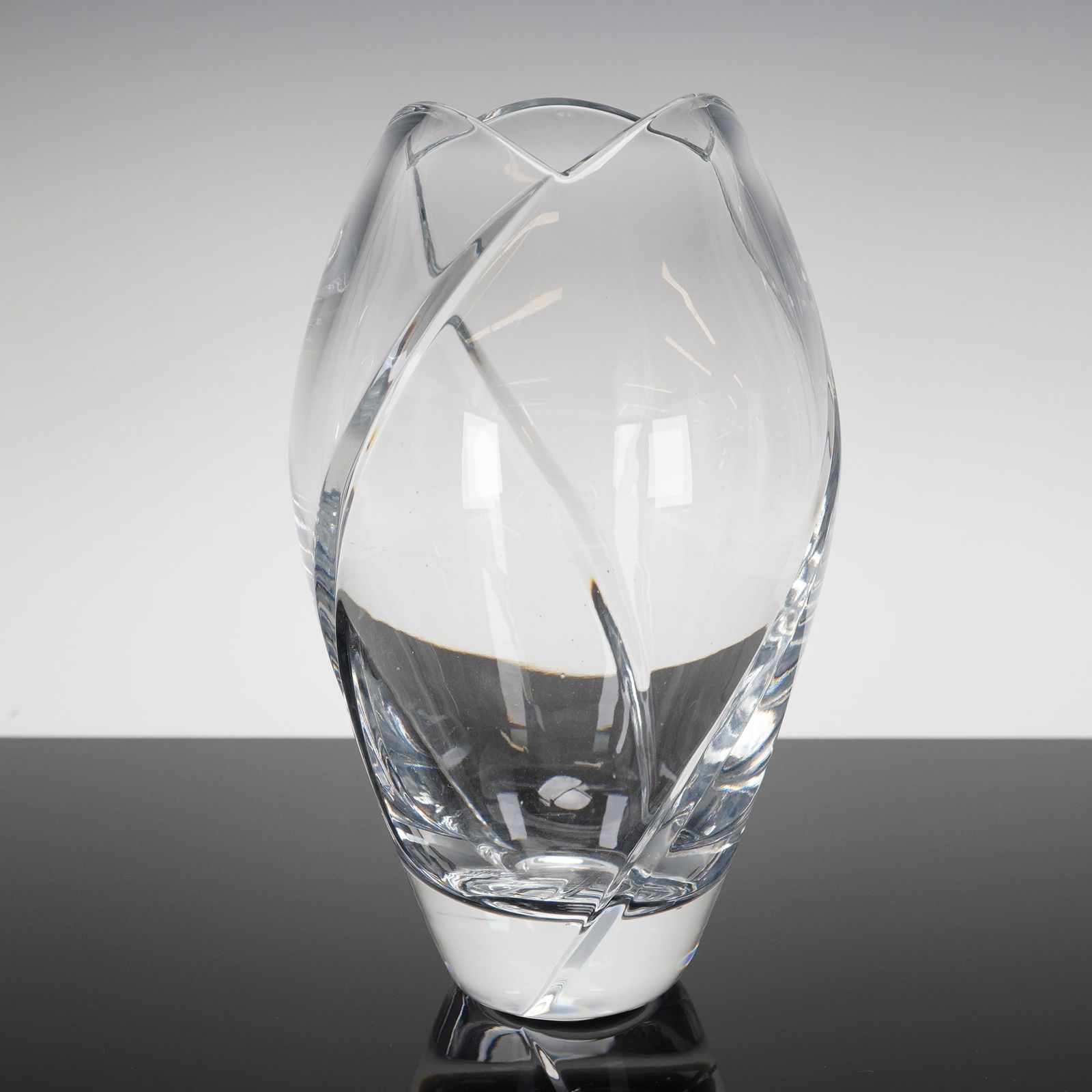 Mikasa Crystal Swirl Tulip Vase: A single Mikasa Crystal Vase, identified by the market consensus as a Tulip or Swirl design, likely manufactured in Slovenia. The heavy lead crystal object features a sculptural, ovoid body resting on